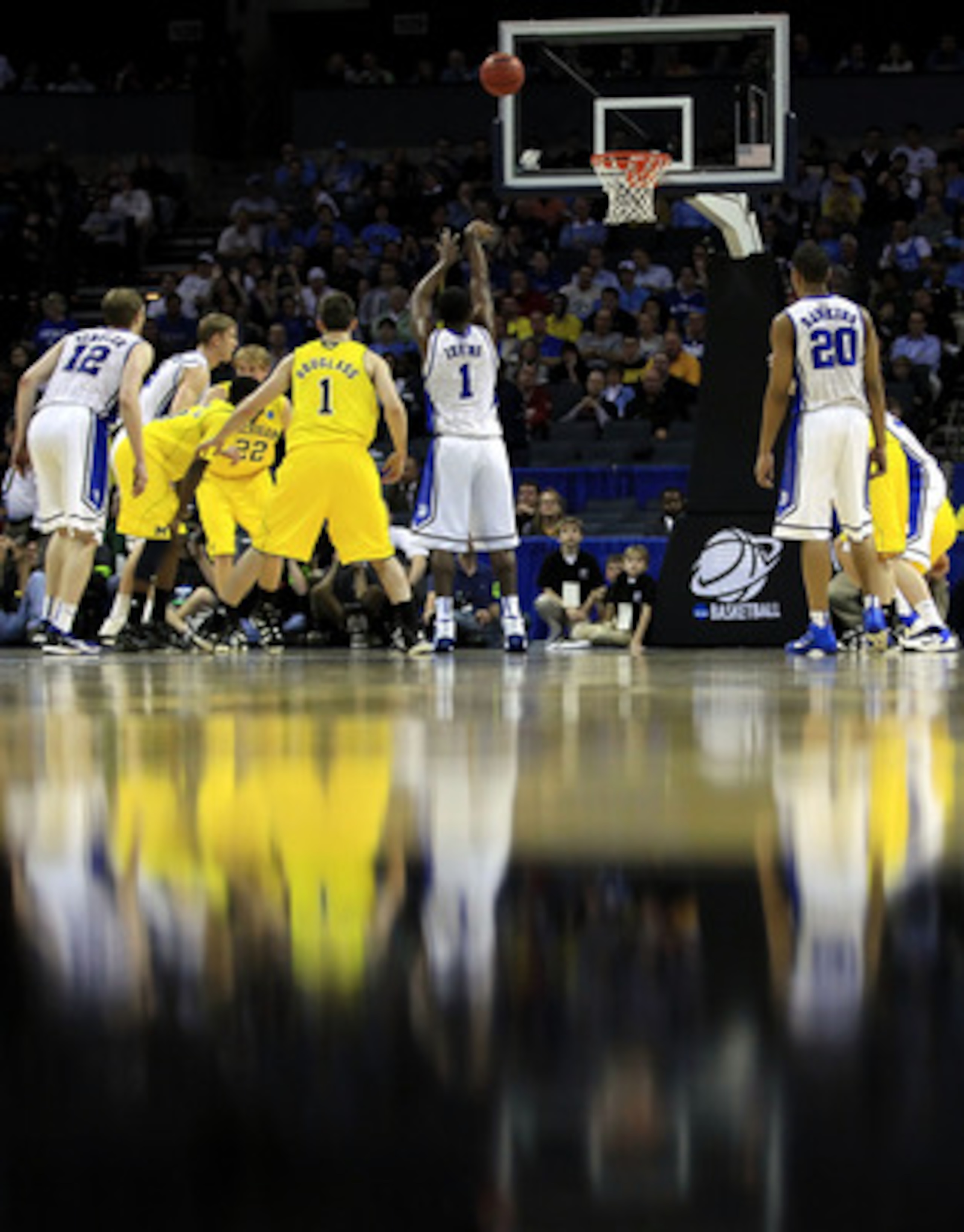 CHARLOTTE, NC - MARCH 20:  Kyrie Irving #1 of the Duke Blue Devils shoots a free throw while taking on the Michigan Wolverines during the third round of the 2011 NCAA men's basketball tournament at Time Warner Cable Arena on March 20, 2011 in Charlotte, N