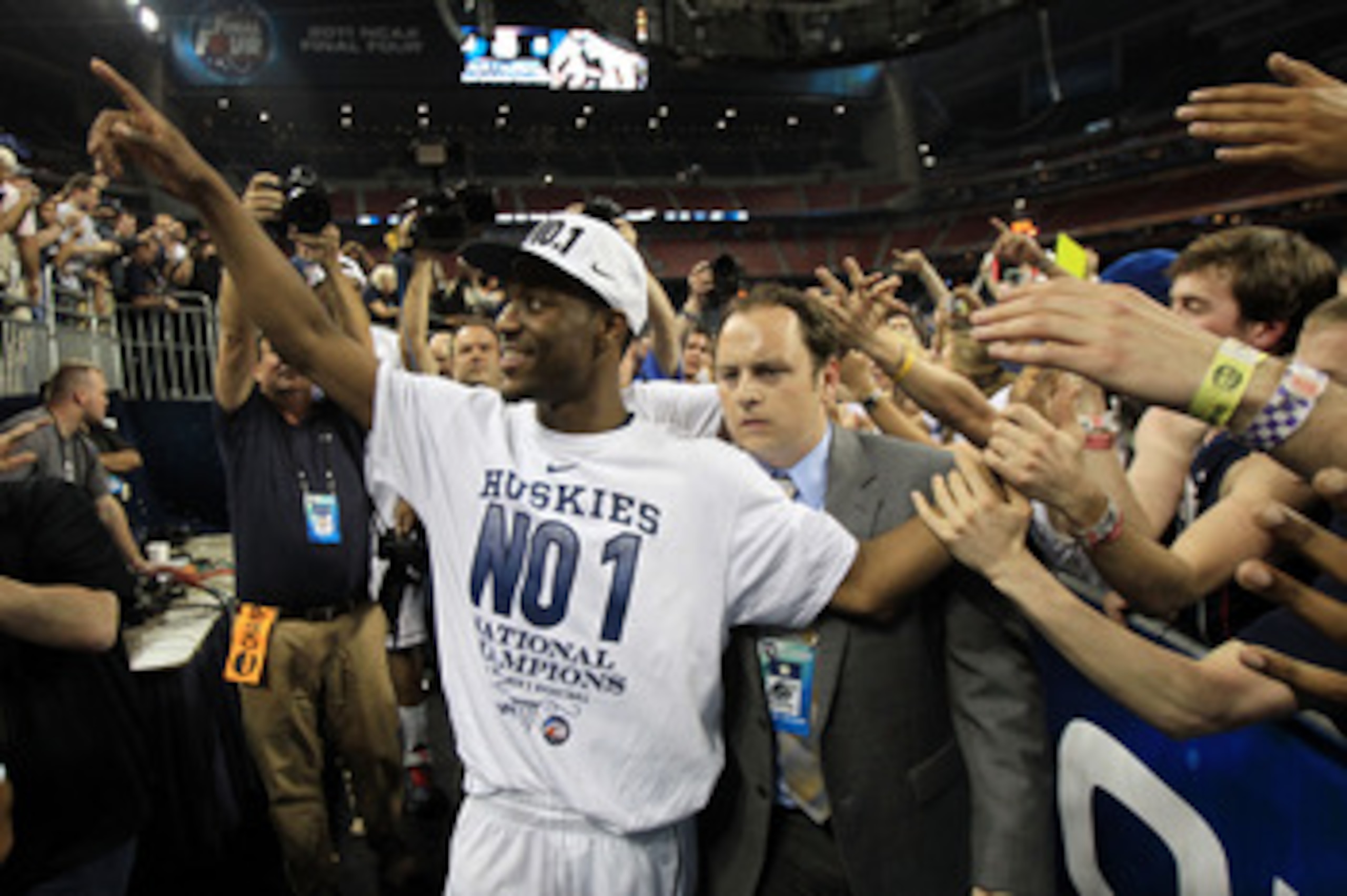 HOUSTON, TX - APRIL 04:  Kemba Walker #15 of the Connecticut Huskies walks off the court after defeating the Butler Bulldogs to win the National Championship Game of the 2011 NCAA Division I Men's Basketball Tournament by a score of 53-41 at Reliant Stadi