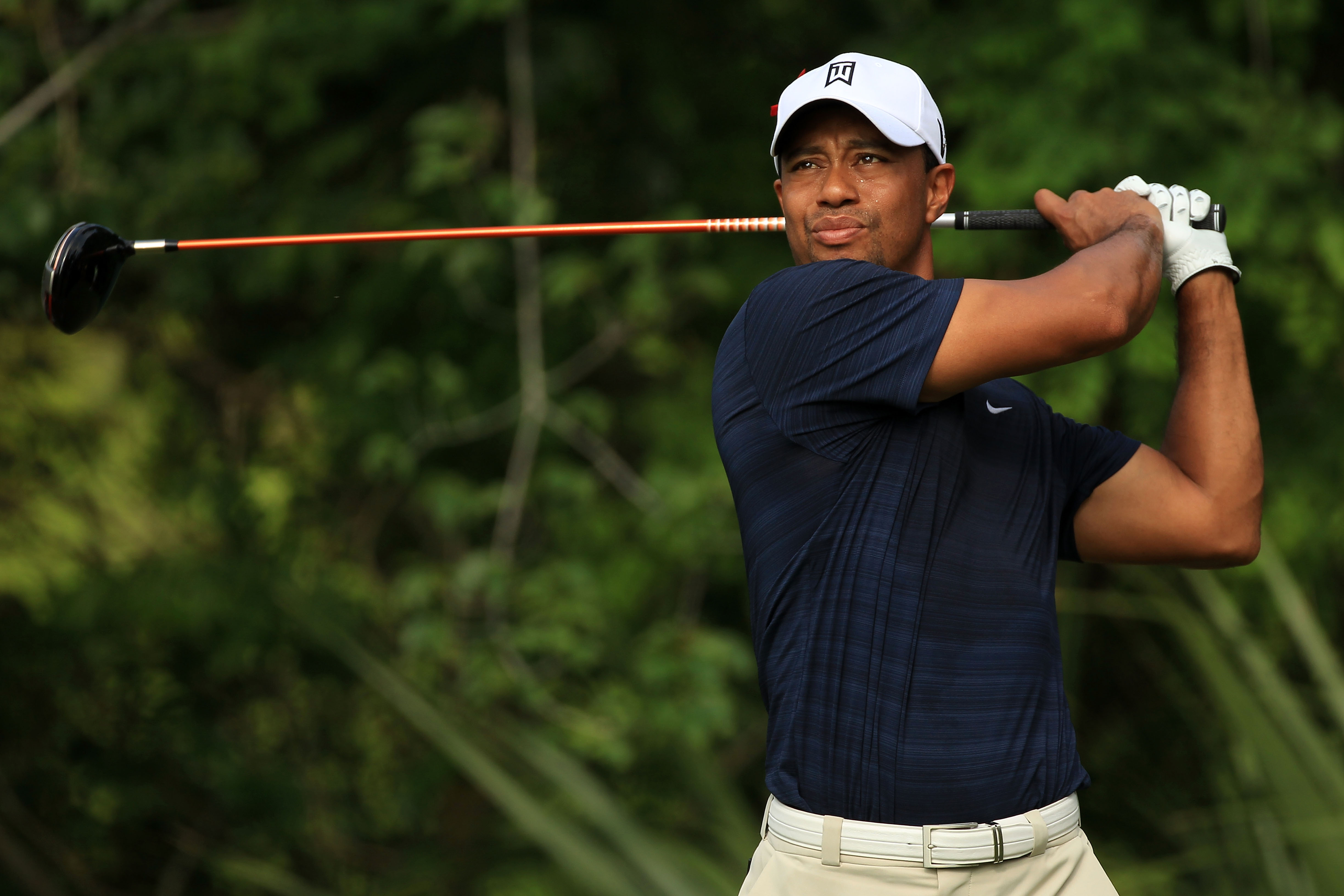 PONTE VEDRA BEACH, FL - MAY 12:  Tiger Woods hits a tee shot on the fifth hole during the first round of THE PLAYERS Championship held at THE PLAYERS Stadium course at TPC Sawgrass on May 12, 2011 in Ponte Vedra Beach, Florida.  (Photo by Streeter Lecka/G