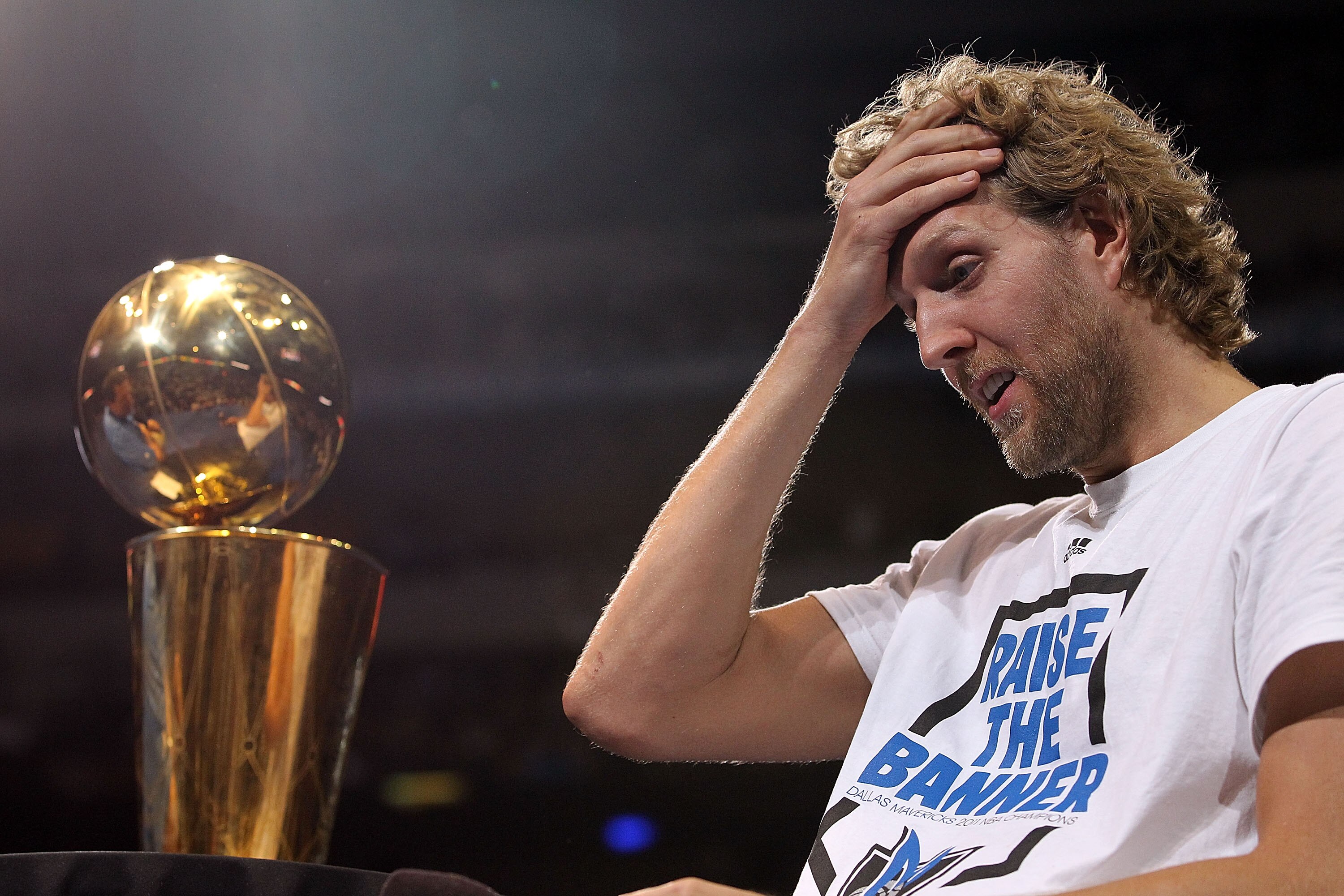 DALLAS, TX - JUNE 16:  Dirk Nowitzki of the Dallas Mavericks gets emotional after the Dallas Mavericks Victory Parade at American Airlines Center on June 16, 2011 in Dallas, Texas.  (Photo by Ronald Martinez/Getty Images)