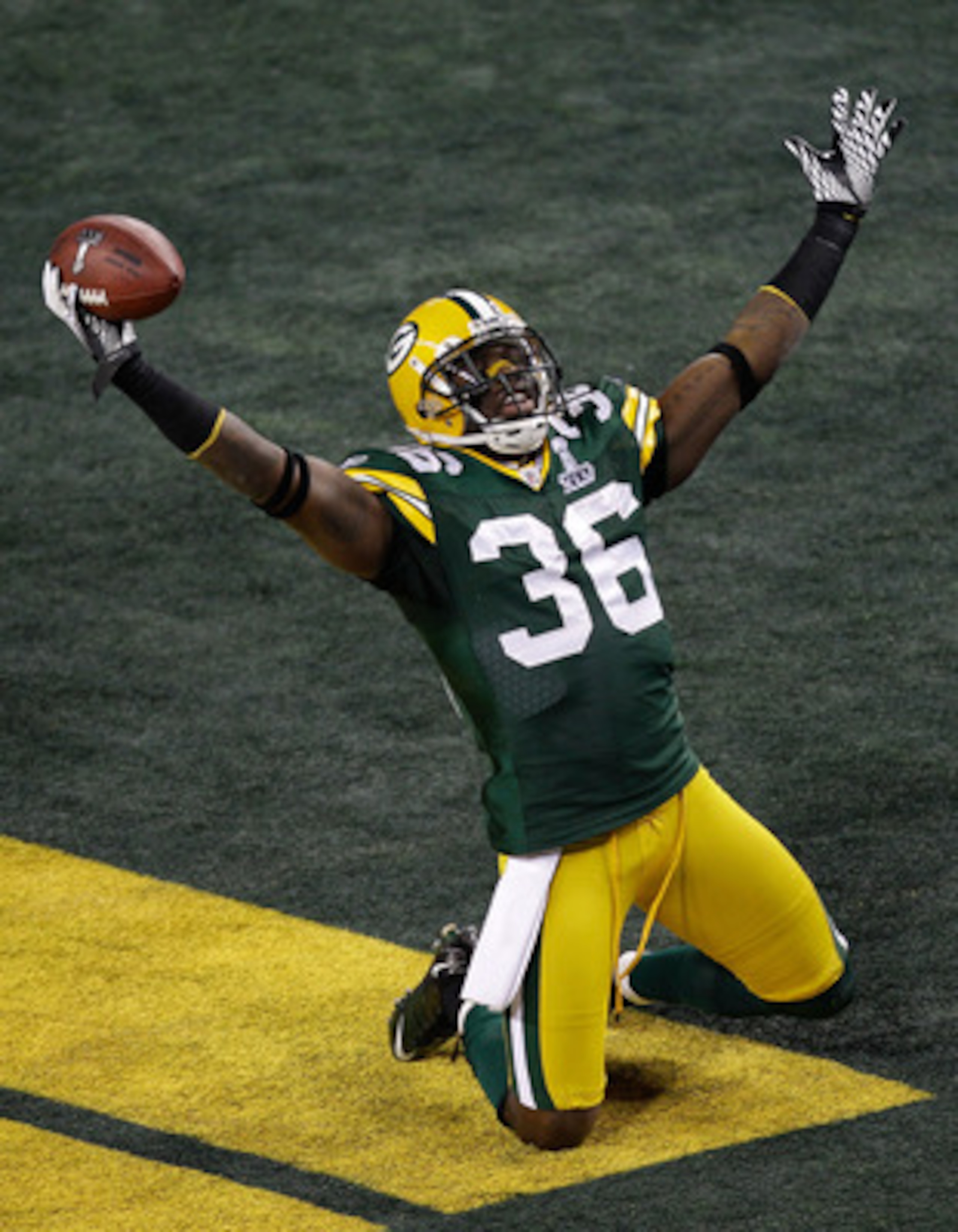 ARLINGTON, TX - FEBRUARY 06:  Nick Collins #36 of the Green Bay Packers celebrates after scoring a 37 yard touchdown on an interception in the first quarter against the Pittsburgh Steelers during Super Bowl XLV at Cowboys Stadium on February 6, 2011 in Ar