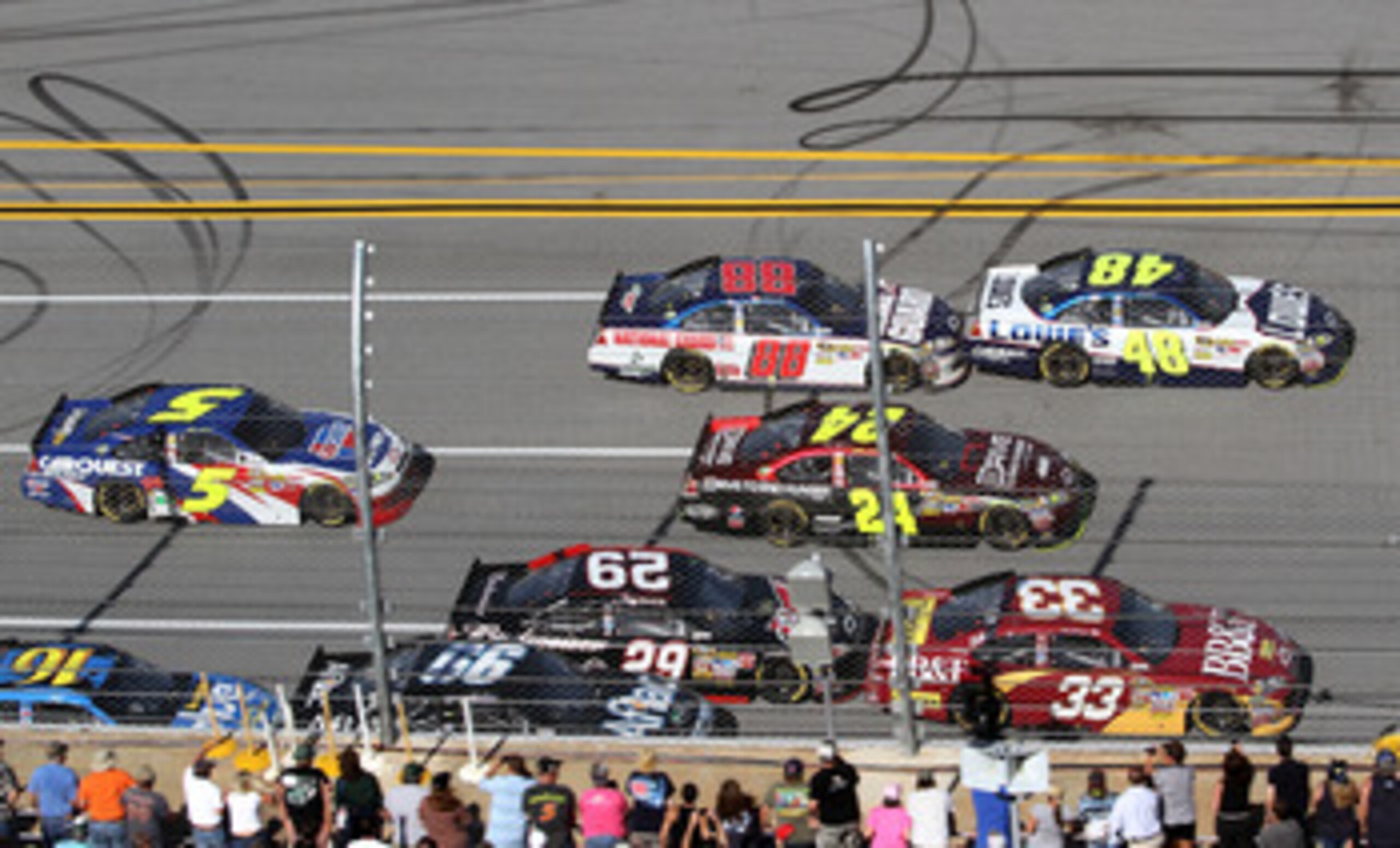 TALLADEGA, AL - APRIL 17:  Clint Bowyer, driver of the #33 BB&T Chevrolet, Jeff Gordon, driver of the #24 Drive to End Hunger/AARP Chevrolet, and Jimmie Johnson, driver of the #48 Lowe's Chevrolet, lead Kevin Harvick, driver of the #29 Budweiser Chevrolet