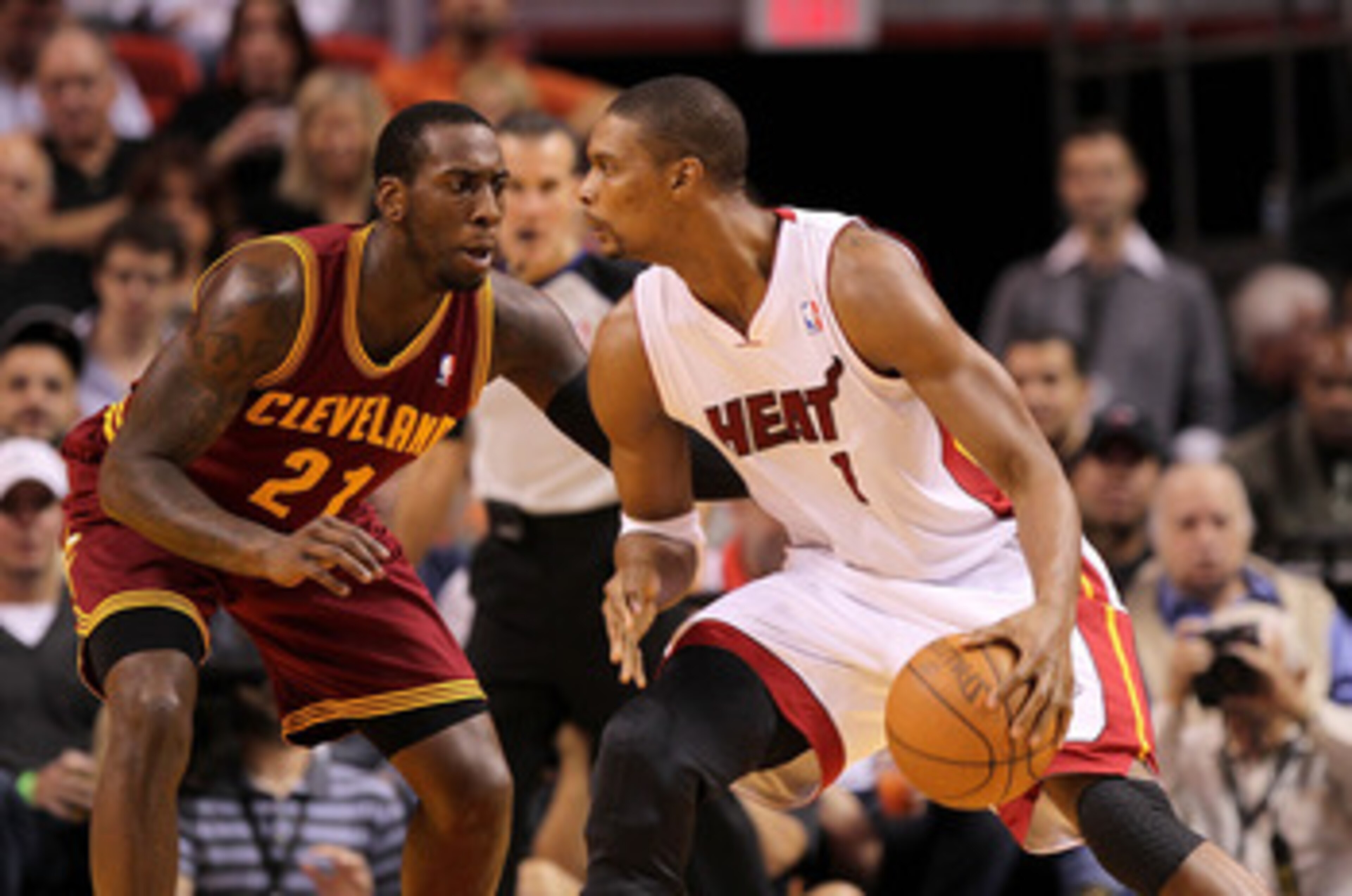 MIAMI, FL - JANUARY 31: Chris Bosh #1 of the Miami Heat posts up J.J. Hickson #21 of the Cleveland Cavaliers during a game at American Airlines Arena on January 31, 2011 in Miami, Florida. NOTE TO USER: User expressly acknowledges and agrees that, by do MIAMI, FL - JANUARY 31: Chris Bosh #1 of the Miami Heat posts up J.J. Hickson #21 of the Cleveland Cavaliers during a game at American Airlines Arena on January 31, 2011 in Miami, Florida. NOTE TO USER: User expressly acknowledges and agrees that, by do