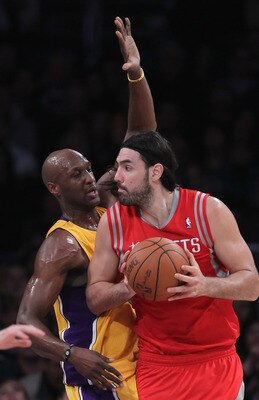 LOS ANGELES, CA - FEBRUARY 01: Luis Scola #4 of the Houston Rockets is defended by Lamar Odom #7 of the Los Angeles Lakers in the first half at Staples Center on February 1, 2011 in Los Angeles, California. The Lakers defeated the Rockets 114-106. NOTE T LOS ANGELES, CA - FEBRUARY 01: Luis Scola #4 of the Houston Rockets is defended by Lamar Odom #7 of the Los Angeles Lakers in the first half at Staples Center on February 1, 2011 in Los Angeles, California. The Lakers defeated the Rockets 114-106. NOTE T