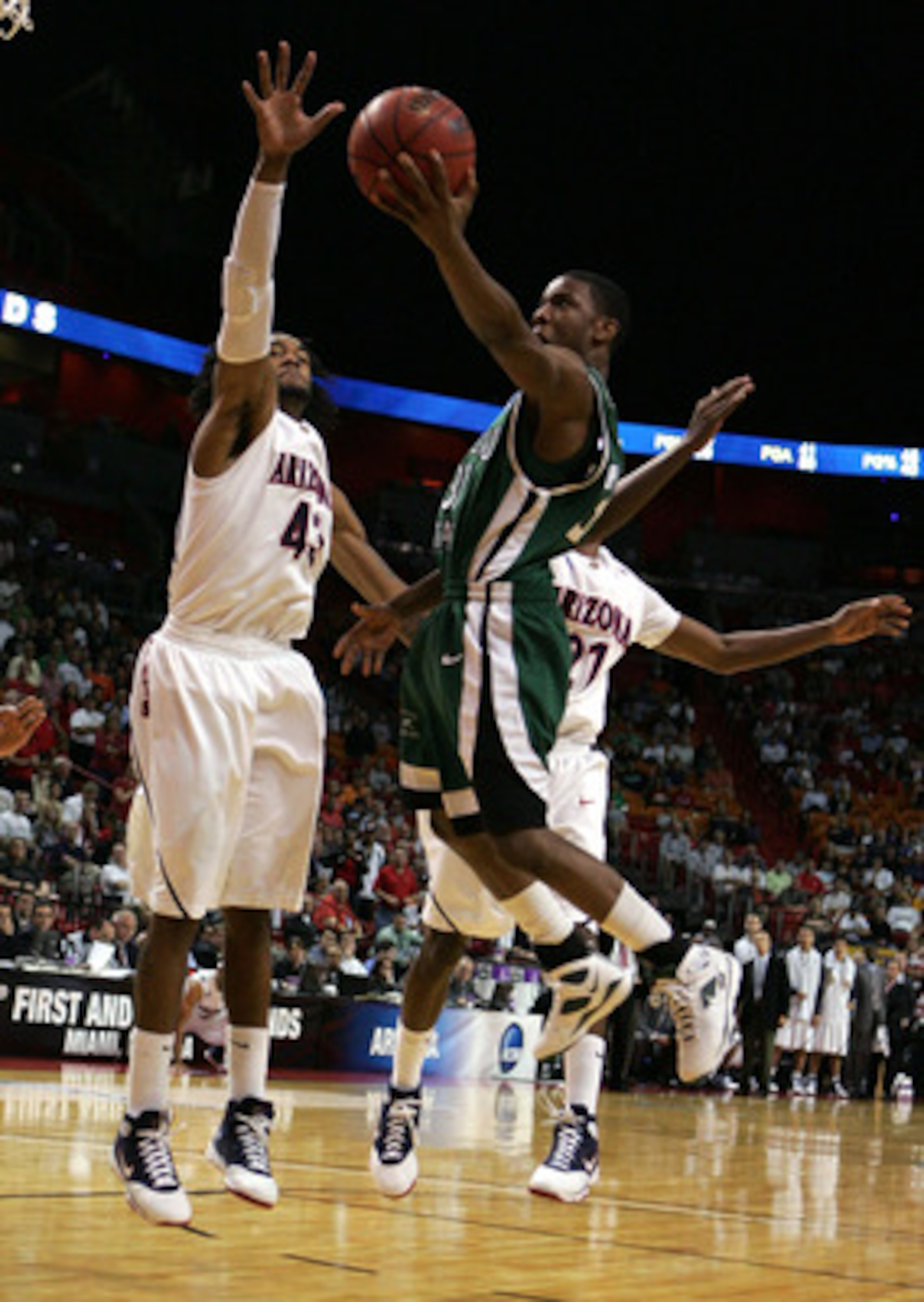 MIAMI - MARCH 22: Forward Jordan Hill #43 of the University of Arizona Wildcats blocks the shot of guard Norris Cole #30 of the Cleveland State University Vikings during the second round of the NCAA Division I Men's Basketball Tournament at the American MIAMI - MARCH 22: Forward Jordan Hill #43 of the University of Arizona Wildcats blocks the shot of guard Norris Cole #30 of the Cleveland State University Vikings during the second round of the NCAA Division I Men's Basketball Tournament at the American