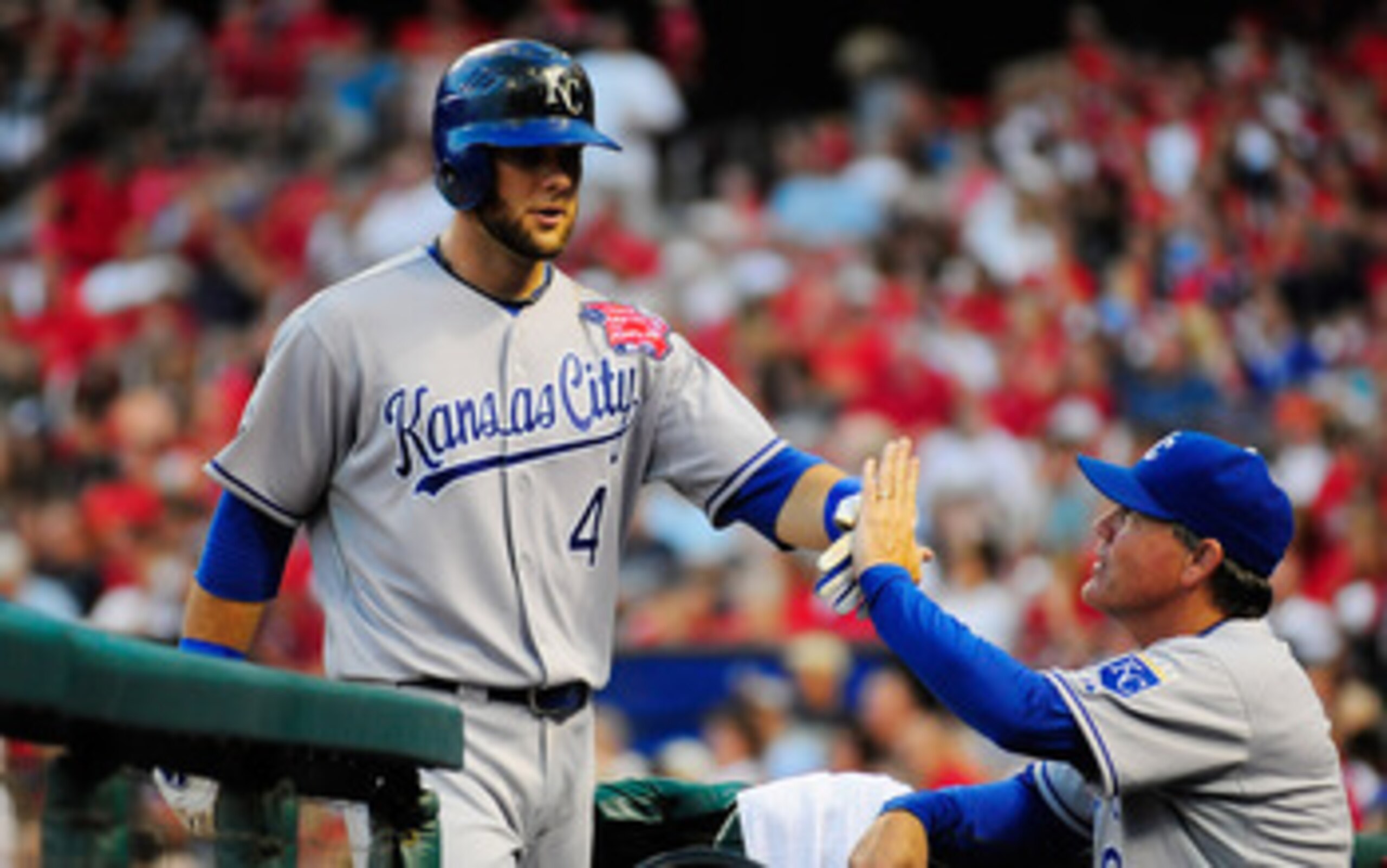 ST. LOUIS, MO - JUNE 18: Alex Gordon #4 of the Kansas City Royals high fives Ned Yost #3 after hitting a solo home run against the St. Louis Cardinals at Busch Stadium on June 18, 2011 in St. Louis, Missouri.  (Photo by Jeff Curry/Getty Images)