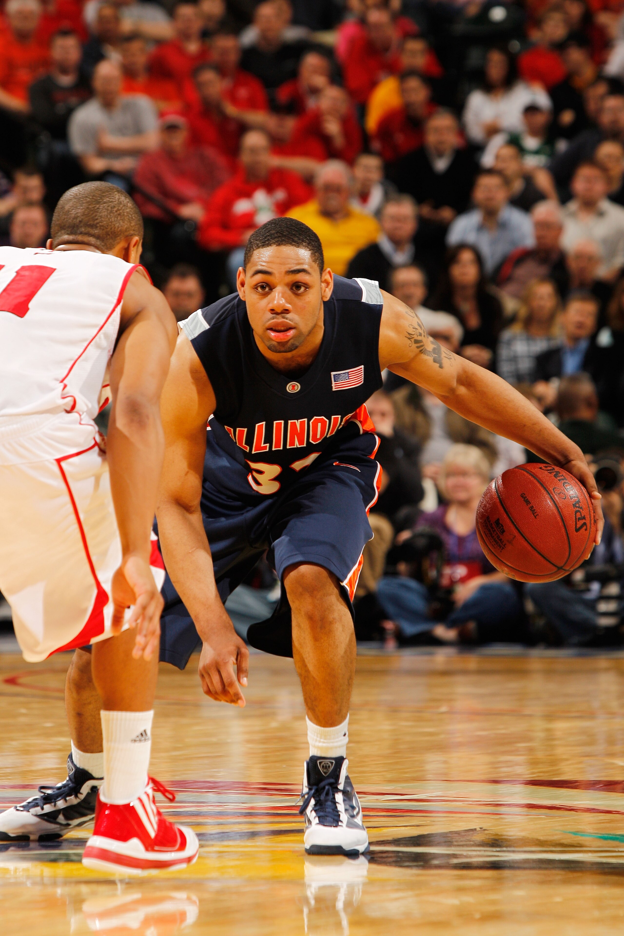 INDIANAPOLIS - MARCH 12:  Guard Demetri McCamey #32 of the Illinois Fighting Illini controls the ball against the Wisconsin Badgers during the quarterfinals of the Big Ten Men's Basketball Tournament at Conseco Fieldhouse on March 12, 2010 in Indianapolis