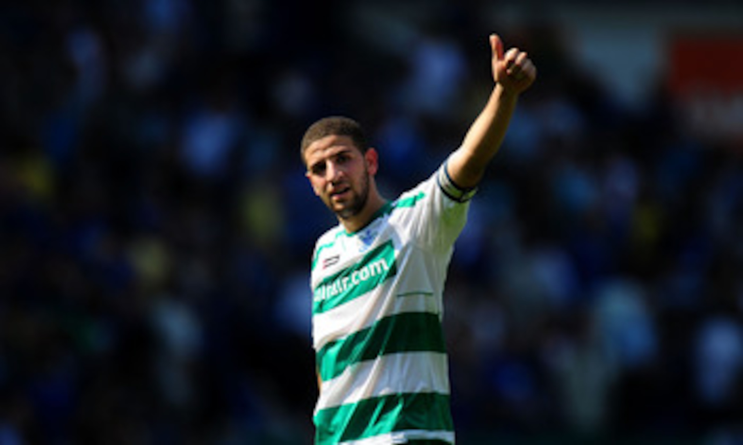 CARDIFF, WALES - APRIL 23:  QPR  player Adel Taarabt acknowledges the fans at the end of the npower Championship game between Cardiff City and Queens Park Rangers at Cardiff City Stadium on April 23, 2011 in Cardiff, Wales.  (Photo by Stu Forster/Getty Im