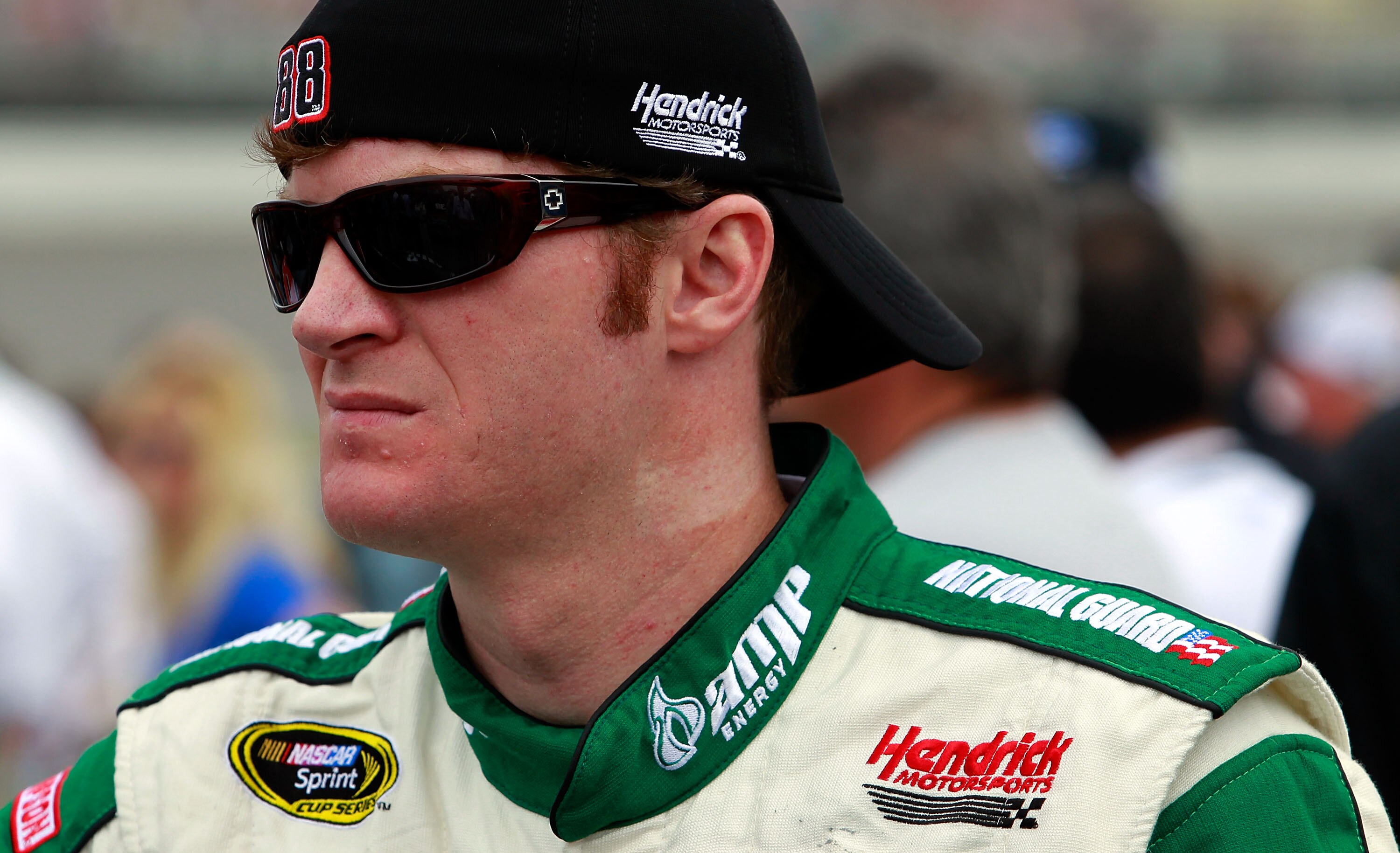 BROOKLYN, MI - JUNE 19:  Dale Earnhardt Jr., driver of the #88 AMP Energy/National Guard Chevrolet, stands on the grid prior to the NASCAR Sprint Cup Series Heluva Good! Sour Cream Dips 400 at Michigan International Speedway on June 19, 2011 in Brooklyn,