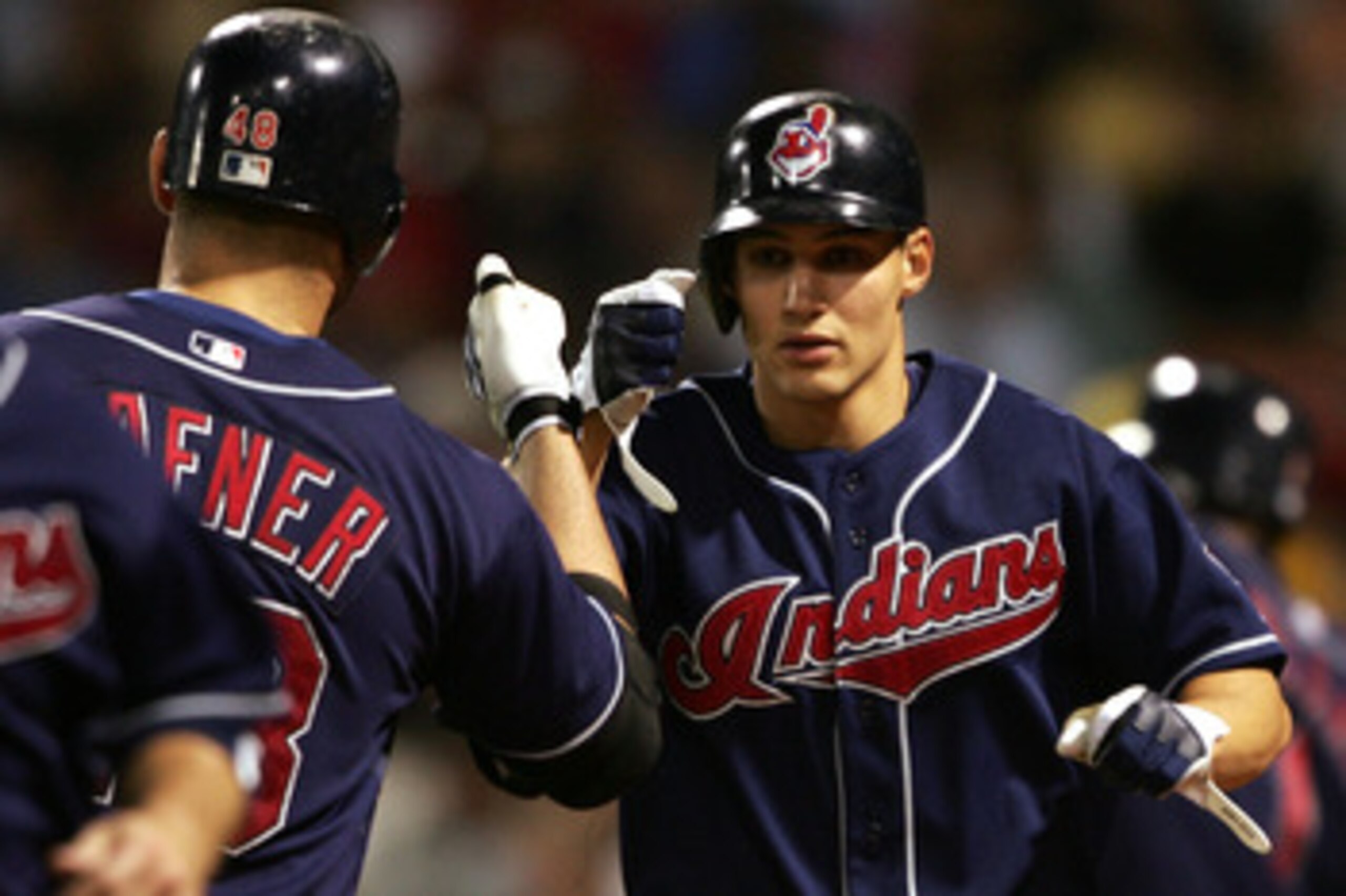BOSTON - MAY 30:  Grady Sizemore #24 of the Cleveland Indians is congratulated by teammate Travis Hafner #48 after Sizemore hit a two run homer in the sixth inning against the Boston Red Sox on May 30, 2007 at Fenway Park in Boston, Massachusetts.  (Photo