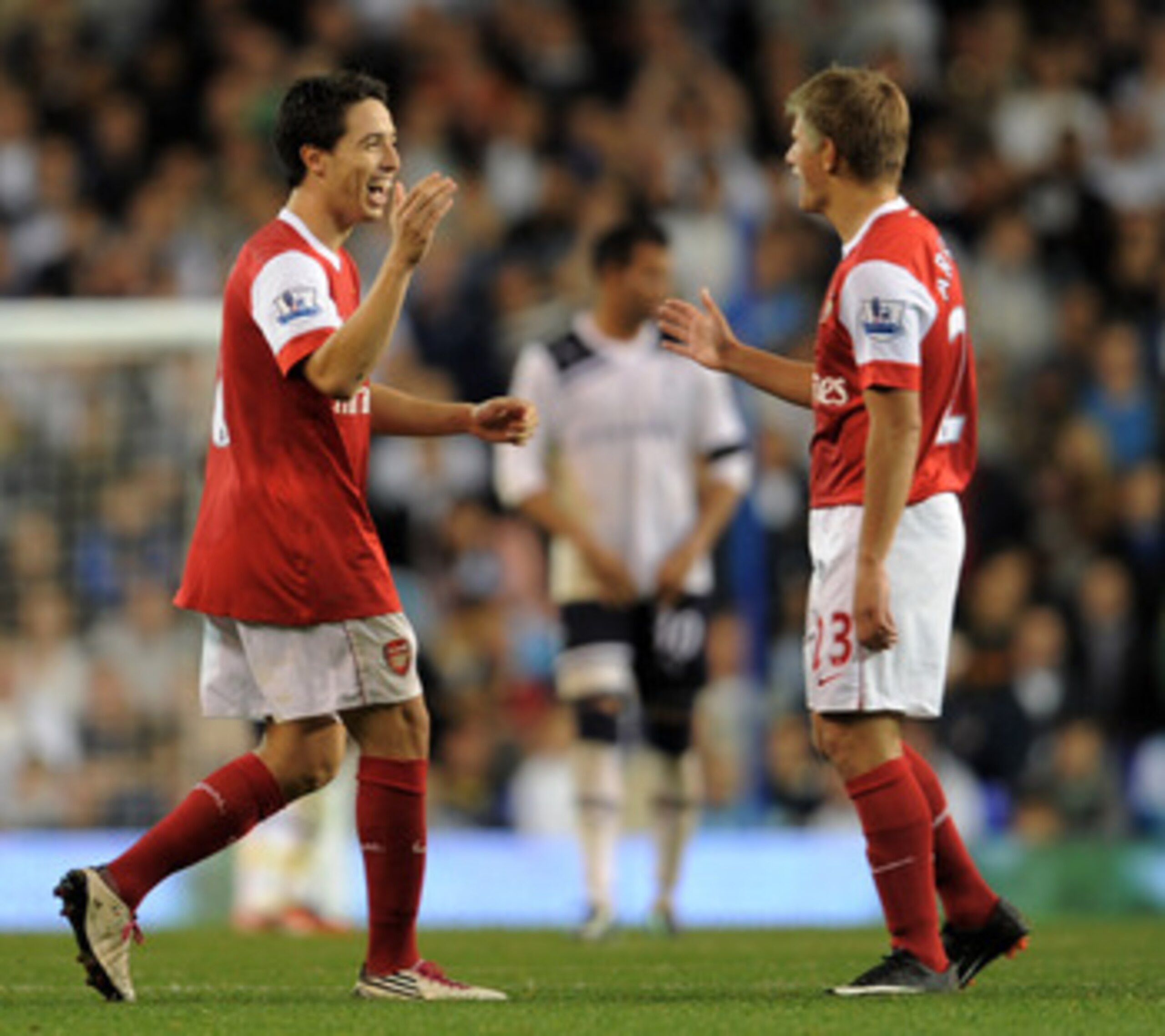 LONDON, ENGLAND - SEPTEMBER 21:  Samir Nasri (C) of Arsenal celebrates with teammate Andrey Arshavin (R) after scoring his team's second goal from the penalty spot during the Carling Cup third round match between Tottenham Hotspur and Arsenal at White Har