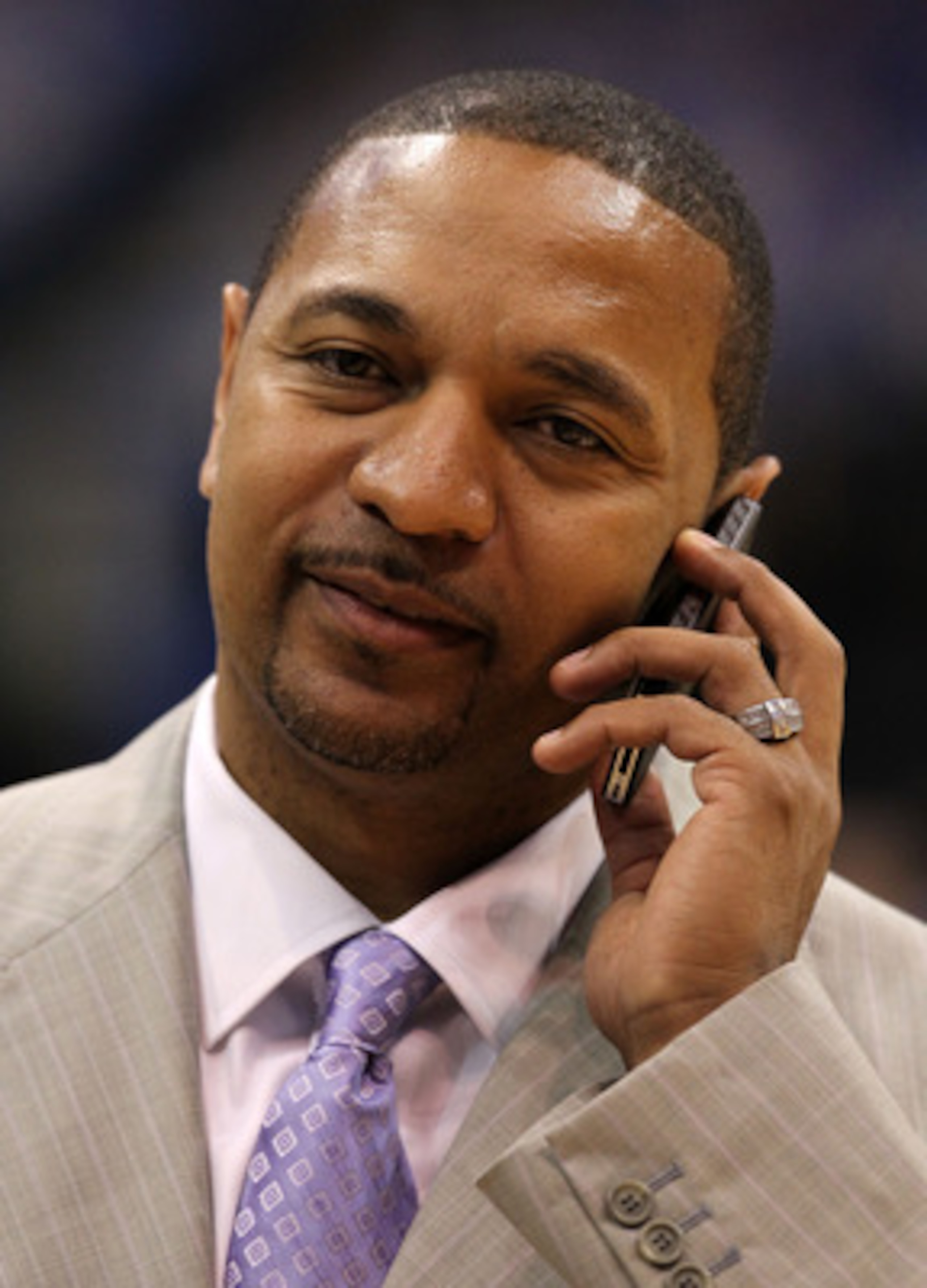 DALLAS, TX - JUNE 07:  ESPN NBA analyst Mark Jackson talks on the phone on the court before Game Four of the 2011 NBA Finals between the Dallas Mavericks and the Miami Heat at American Airlines Center on June 7, 2011 in Dallas, Texas. Jackson was named th