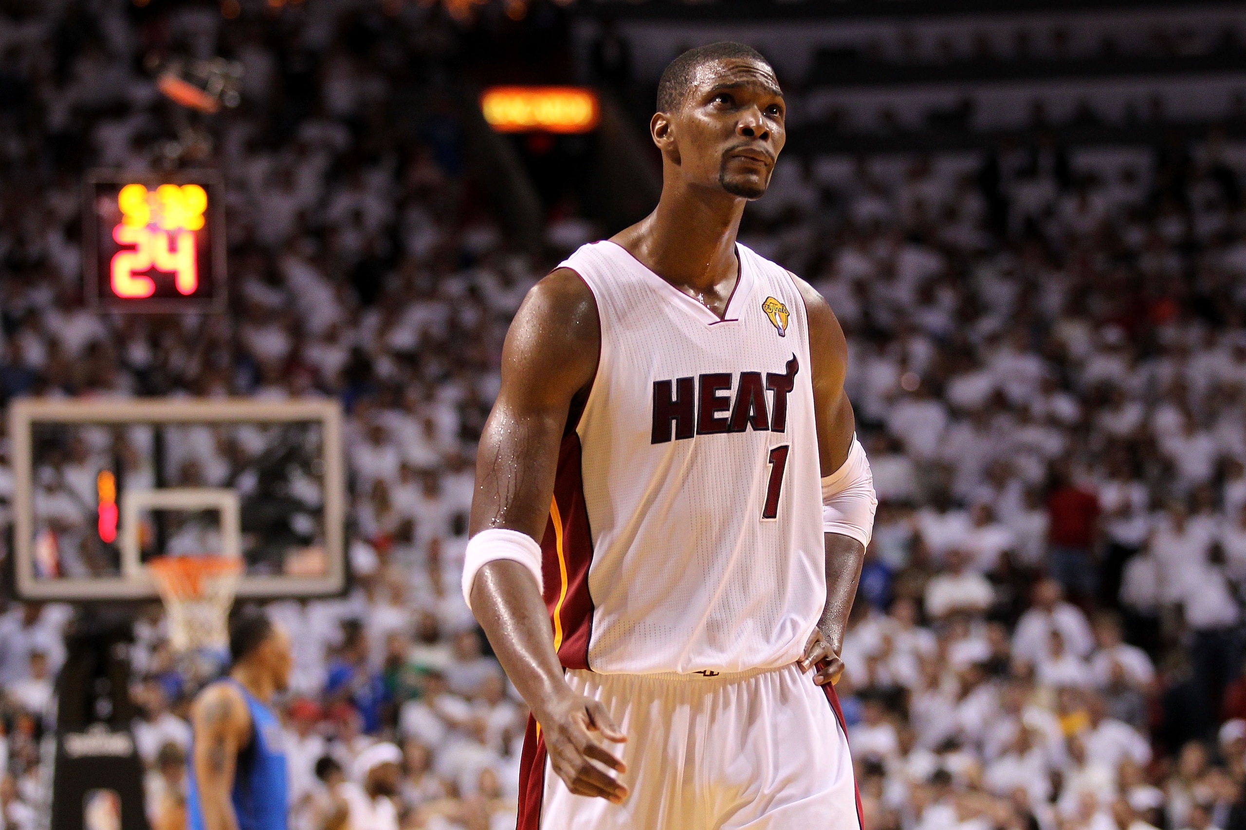 MIAMI, FL - JUNE 12:  Chris Bosh #1 of the Miami Heat looks on against the Dallas Mavericks in the second half of Game Six of the 2011 NBA Finals at American Airlines Arena on June 12, 2011 in Miami, Florida. NOTE TO USER: User expressly acknowledges and