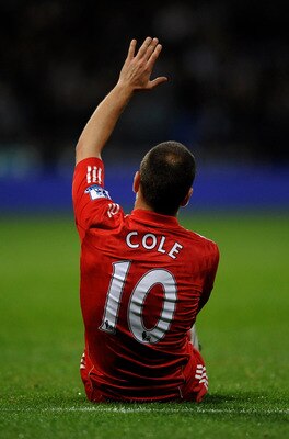 BOLTON, ENGLAND - OCTOBER 31:  Joe Cole of Liverpool gestures after sustaining an injury during the Barclays Premier League match between Bolton Wanderers and Liverpool at the Reebok Stadium on October 31, 2010 in Bolton, England.  (Photo by Laurence Grif