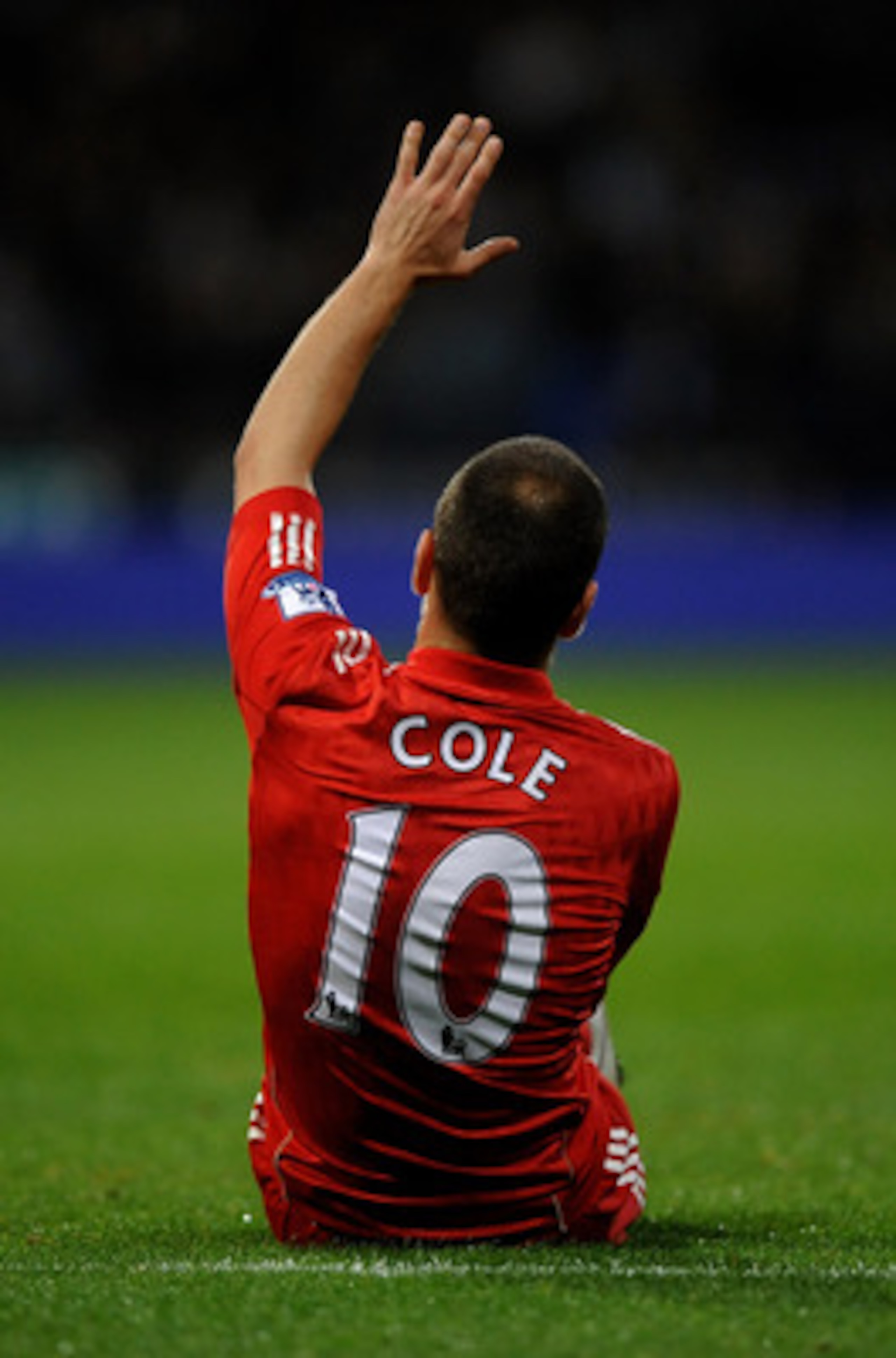 BOLTON, ENGLAND - OCTOBER 31:  Joe Cole of Liverpool gestures after sustaining an injury during the Barclays Premier League match between Bolton Wanderers and Liverpool at the Reebok Stadium on October 31, 2010 in Bolton, England.  (Photo by Laurence Grif