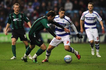 LONDON, ENGLAND - JANUARY 23:  Adel Taarabt of QPR holds off Michael Doyle of Coventry during the npower Championship match between Queens Park Rangers and Coventry City at Loftus Road on January 23, 2011 in London, England.  (Photo by Dean Mouhtaropoulos