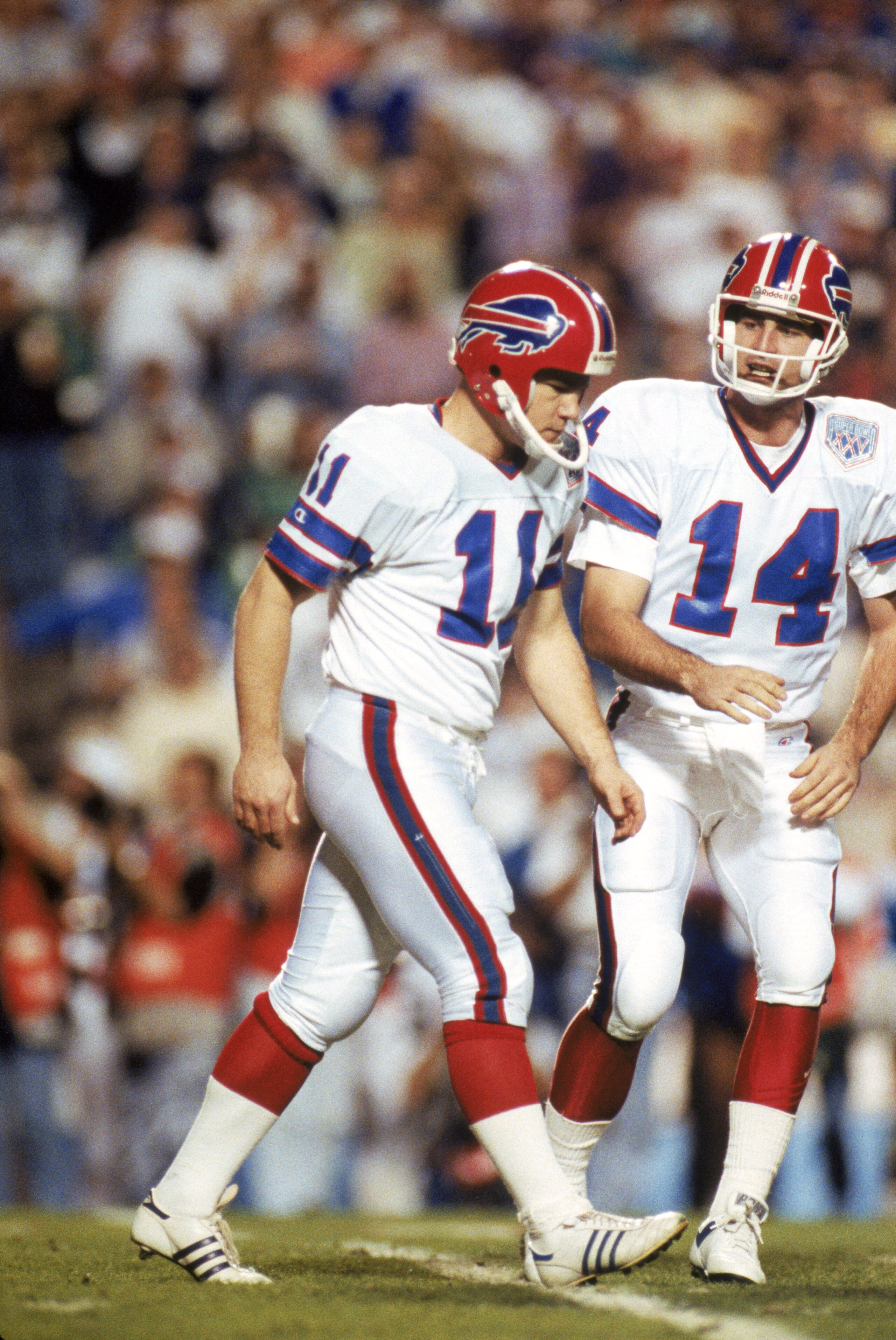 TAMPA, FL - JANUARY 27: Kicker Scott Norwood #11 and quarterback Frank Reich #14 of the Buffalo Bills walk n the field during Super Bowl XXV against the New York Giants at Tampa Stadium on January 27, 1991 in Tampa, Florida. The Giants won 20-19. (Pho TAMPA, FL - JANUARY 27: Kicker Scott Norwood #11 and quarterback Frank Reich #14 of the Buffalo Bills walk n the field during Super Bowl XXV against the New York Giants at Tampa Stadium on January 27, 1991 in Tampa, Florida. The Giants won 20-19. (Pho