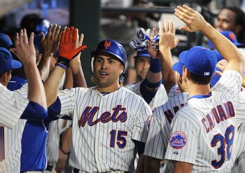 NEW YORK, NY - JUNE 18:  Carlos Beltran #15 of the New York Mets celebrates a two run home run with teamates in the fifth inning against the Los Angeles Angels of Anaheim during their game on June 18, 2011 at Citi Field in the Flushing neighborhood of the