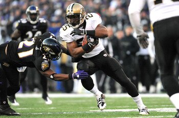 BALTIMORE, MD - DECEMBER 19:  Reggie Bush #25 of the New Orleans Saints runs the ball against the Baltimore Ravens  at M&T Bank Stadium on December 19, 2010 in Baltimore, Maryland. The Ravens defeated the Saints 30-24. (Photo by Larry French/Getty Images)