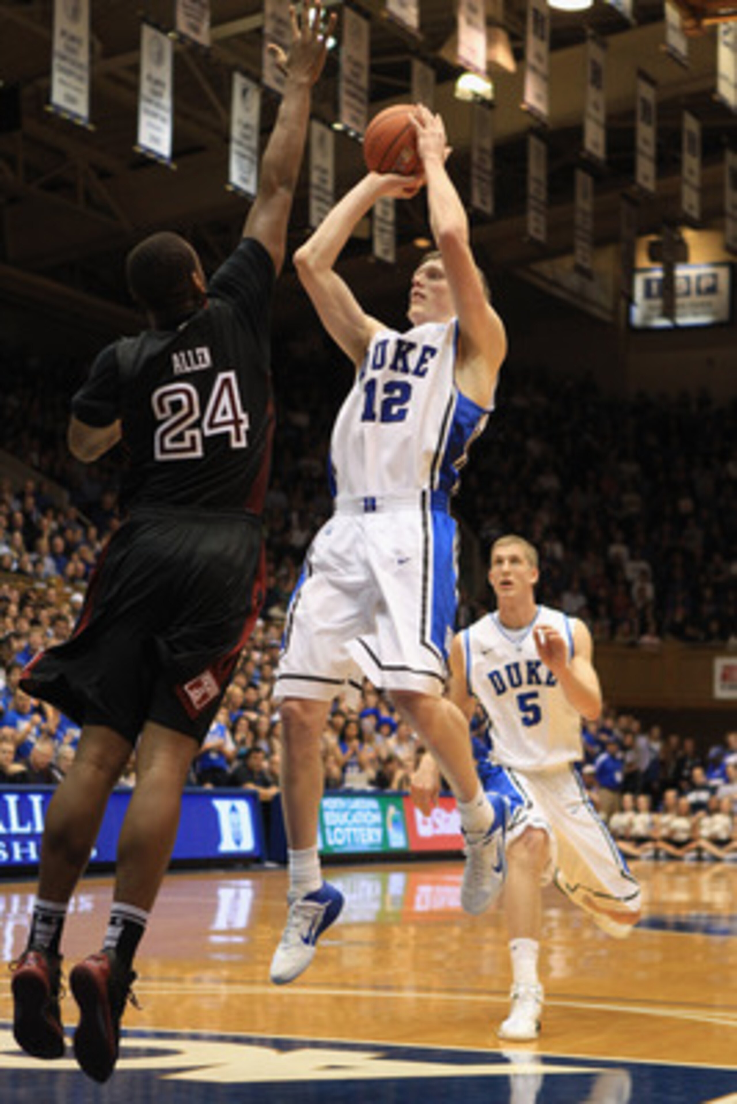 DURHAM, NC - FEBRUARY 23: Lavoy Allen #24 of the Temple Owls tries to stop Kyle Singler #12 of the Duke Blue Devils during their game at Cameron Indoor Stadium on February 23, 2011 in Durham, North Carolina. (Photo by Streeter Lecka/Getty Images) DURHAM, NC - FEBRUARY 23: Lavoy Allen #24 of the Temple Owls tries to stop Kyle Singler #12 of the Duke Blue Devils during their game at Cameron Indoor Stadium on February 23, 2011 in Durham, North Carolina. (Photo by Streeter Lecka/Getty Images)