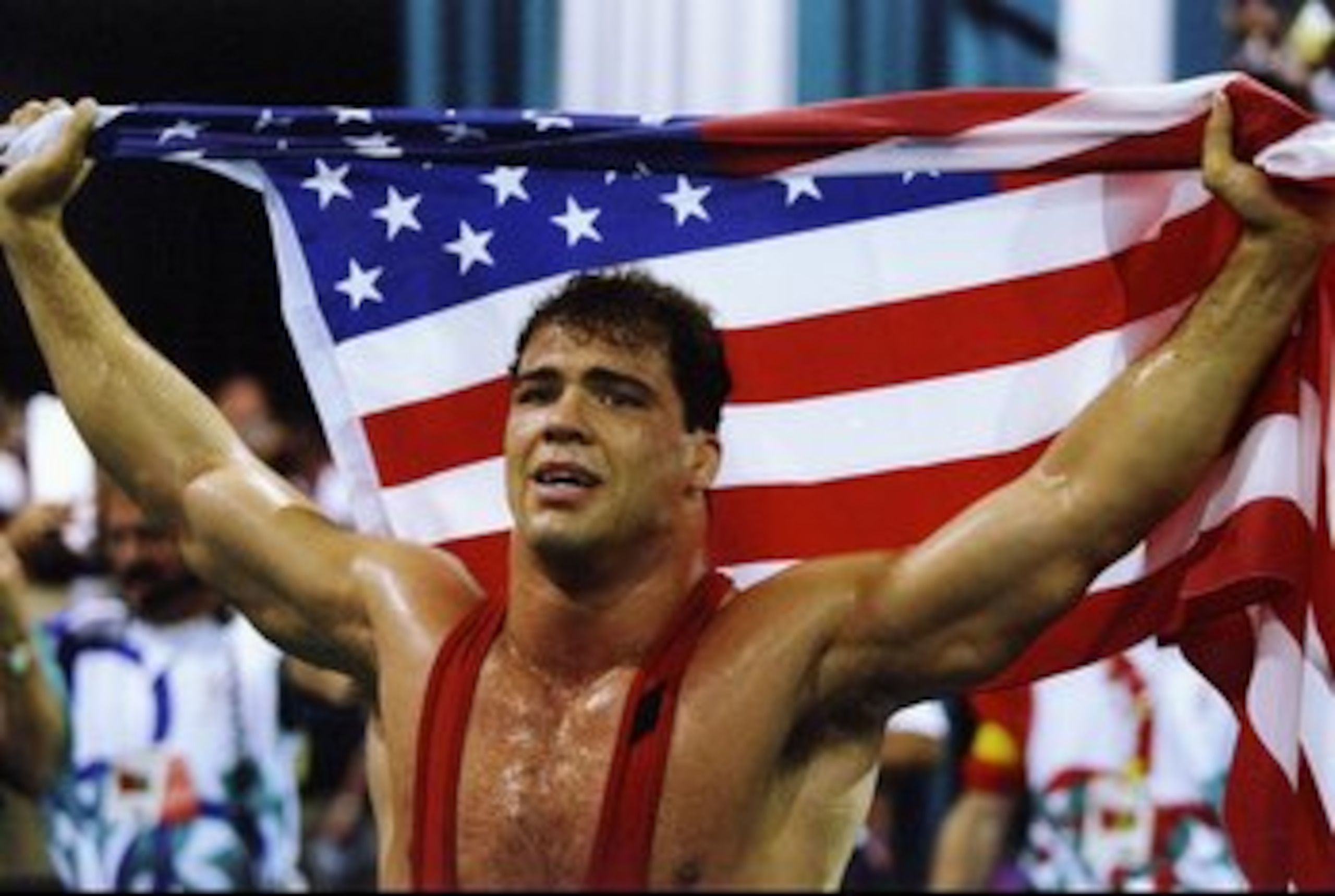 31 Jul 1996: Kurt Angle of the United States holds the American flag at the free-style wrestling competition during the Summer Olympics at the Georgia World Congress Center in Atlanta, Georgia. 31 Jul 1996: Kurt Angle of the United States holds the American flag at the free-style wrestling competition during the Summer Olympics at the Georgia World Congress Center in Atlanta, Georgia.