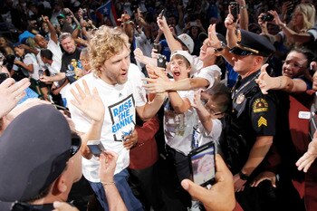 DALLAS, TX - JUNE 16: Forward Dirk Nowitzki of the Dallas Mavericks high fives fans during the Dallas Mavericks Victory celebration on June 16, 2011 in Dallas, Texas. (Photo by Brandon Wade/Getty Images)