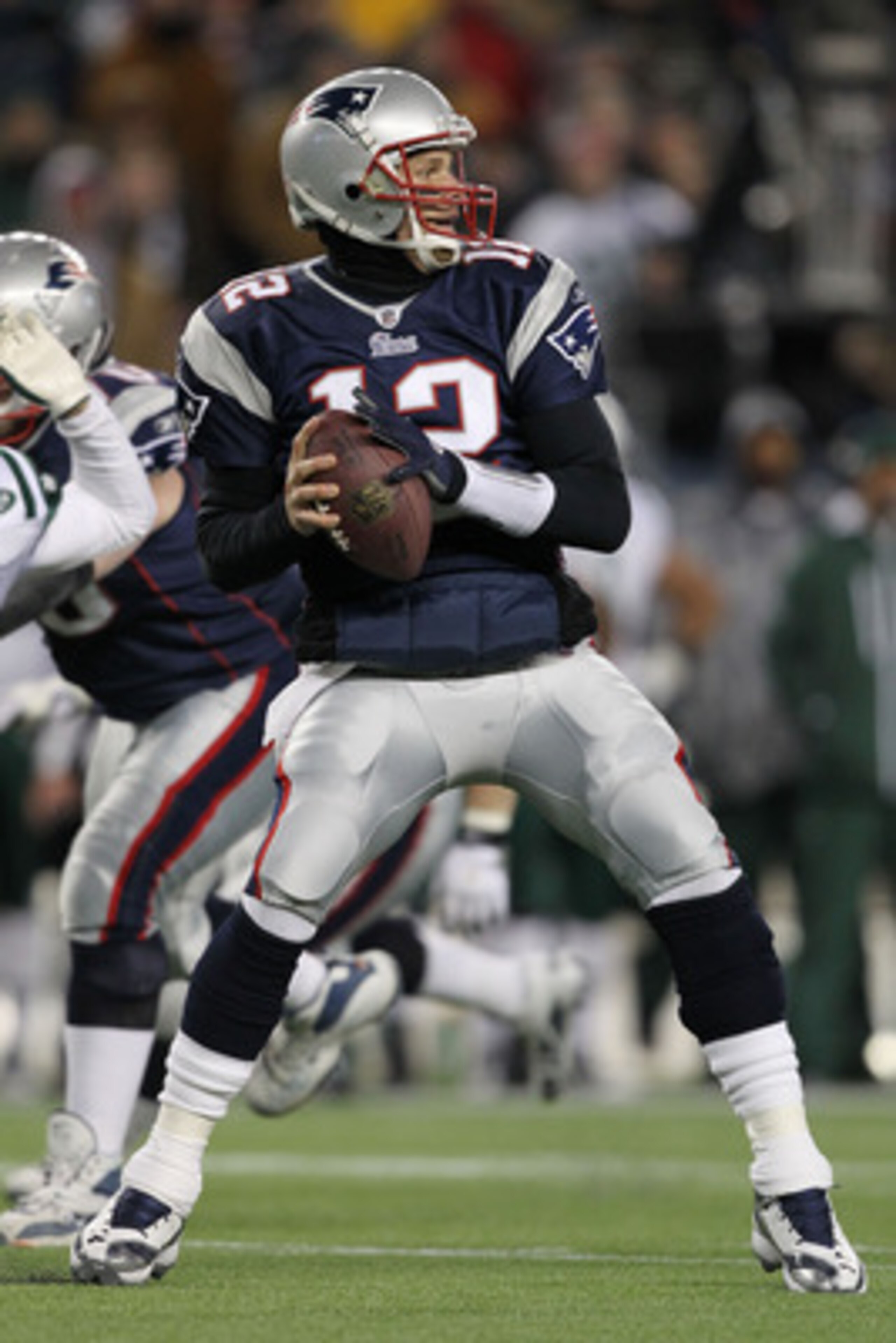 FOXBORO, MA - JANUARY 16:  Quarterback Tom Brady #12 of the New England Patriots looks to pass during their 2011 AFC divisional playoff game against the New York Jets at Gillette Stadium on January 16, 2011 in Foxboro, Massachusetts.  (Photo by Al Bello/G