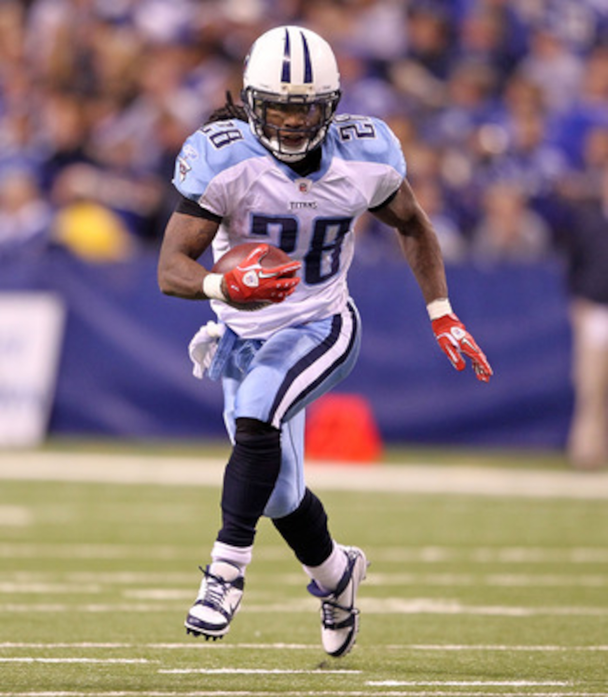 INDIANAPOLIS - JANUARY 02:  Chris Johnson #28 of the Tennessee Titans runs for a touchdown during NFL game against the Indianapolis Colts at Lucas Oil Stadium on January 2, 2011 in Indianapolis, Indiana.  (Photo by Andy Lyons/Getty Images)