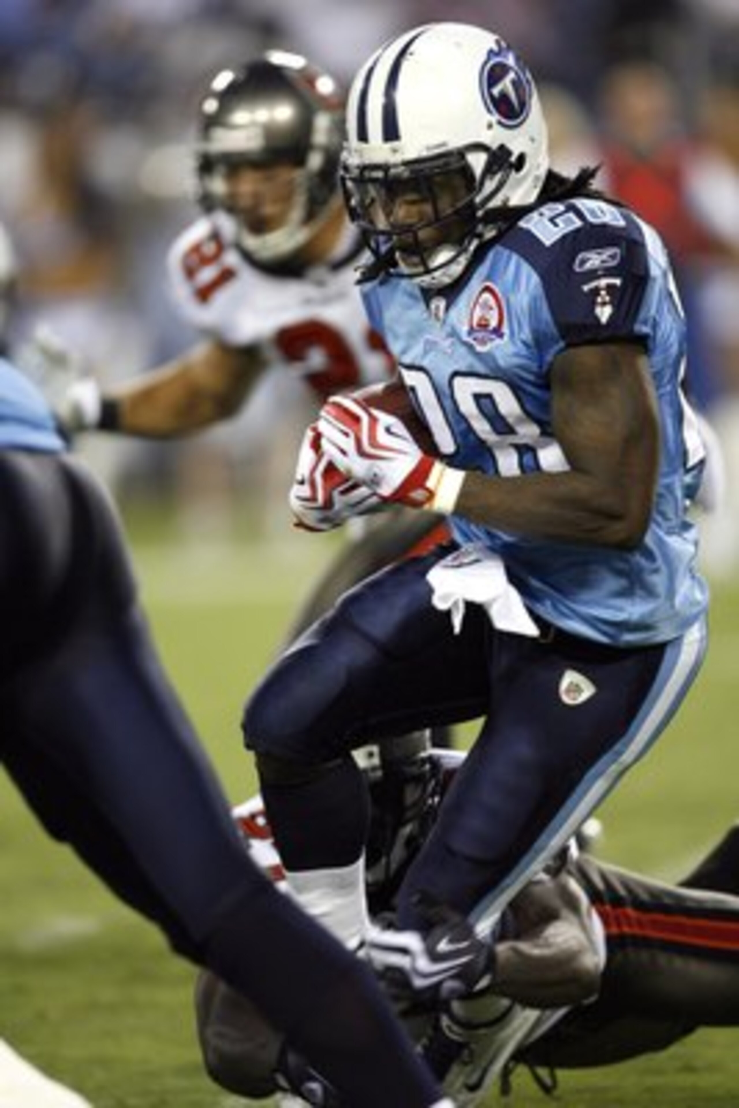 NASHVILLE, TN - AUGUST 15: Chris Johnson #28 of the Tennessee Titans runs with the ball against the Tampa Bay Buccaneers during a preseason NFL game at LP Field on August 15, 2009 in Nashville, Tennessee. The Titans beat the Buccaneers 27-20. (Photo by Jo