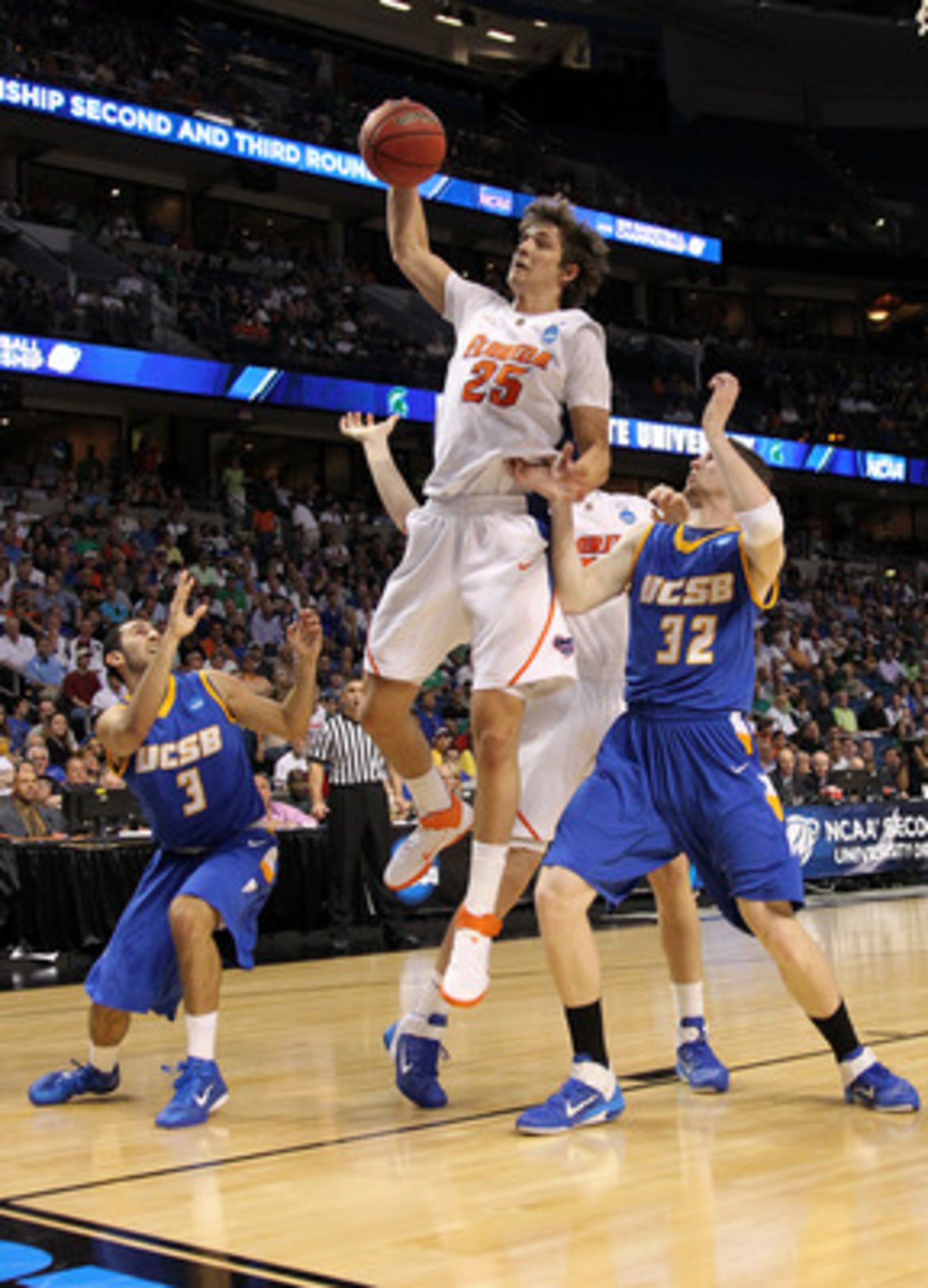 TAMPA, FL - MARCH 17:  Chandler Parsons #25 of the Florida Gators  controls a rebound against Jon Pastorek #32 and Jordan Weiner #3 of the UC Santa Barbara Gauchos in the first half during the second round of the 2011 NCAA men's basketball tournament at S