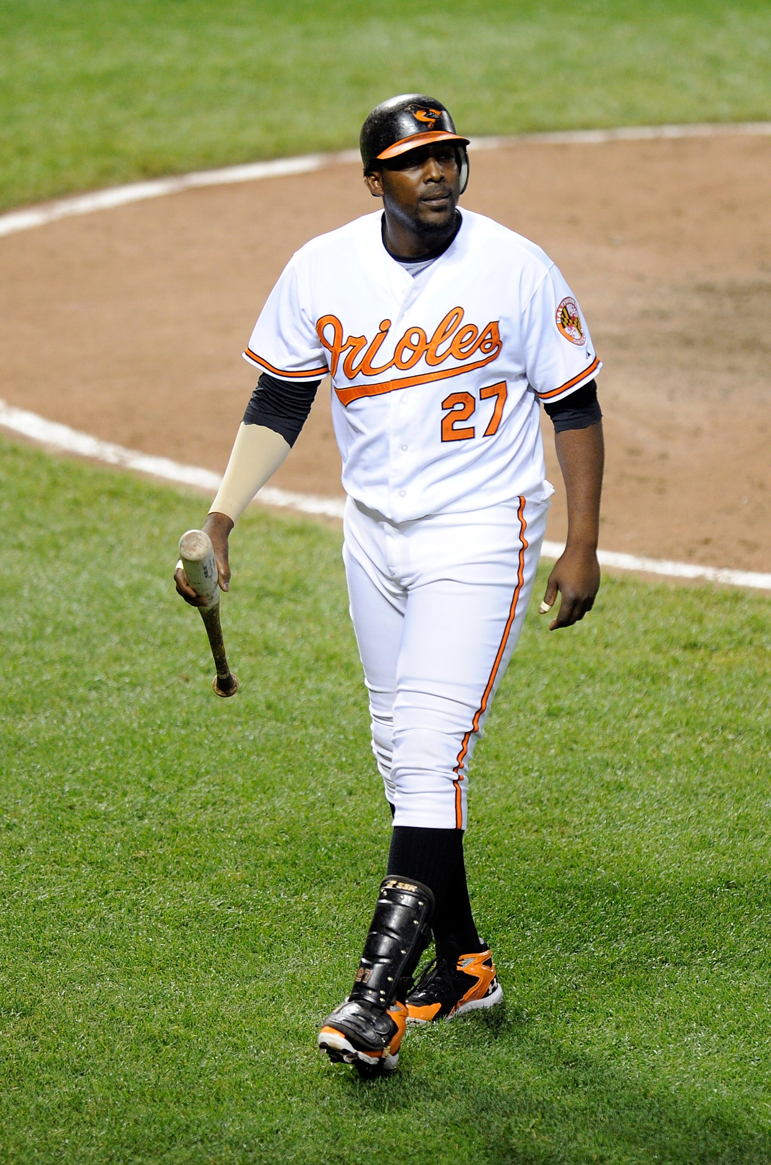 BALTIMORE, MD - JUNE 11:  Vladimir Guerrero #27 of the Baltimore Orioles walks to the dugout after striking out against the Tampa Bay Rays at Oriole Park at Camden Yards on June 11, 2011 in Baltimore, Maryland.  (Photo by Greg Fiume/Getty Images)