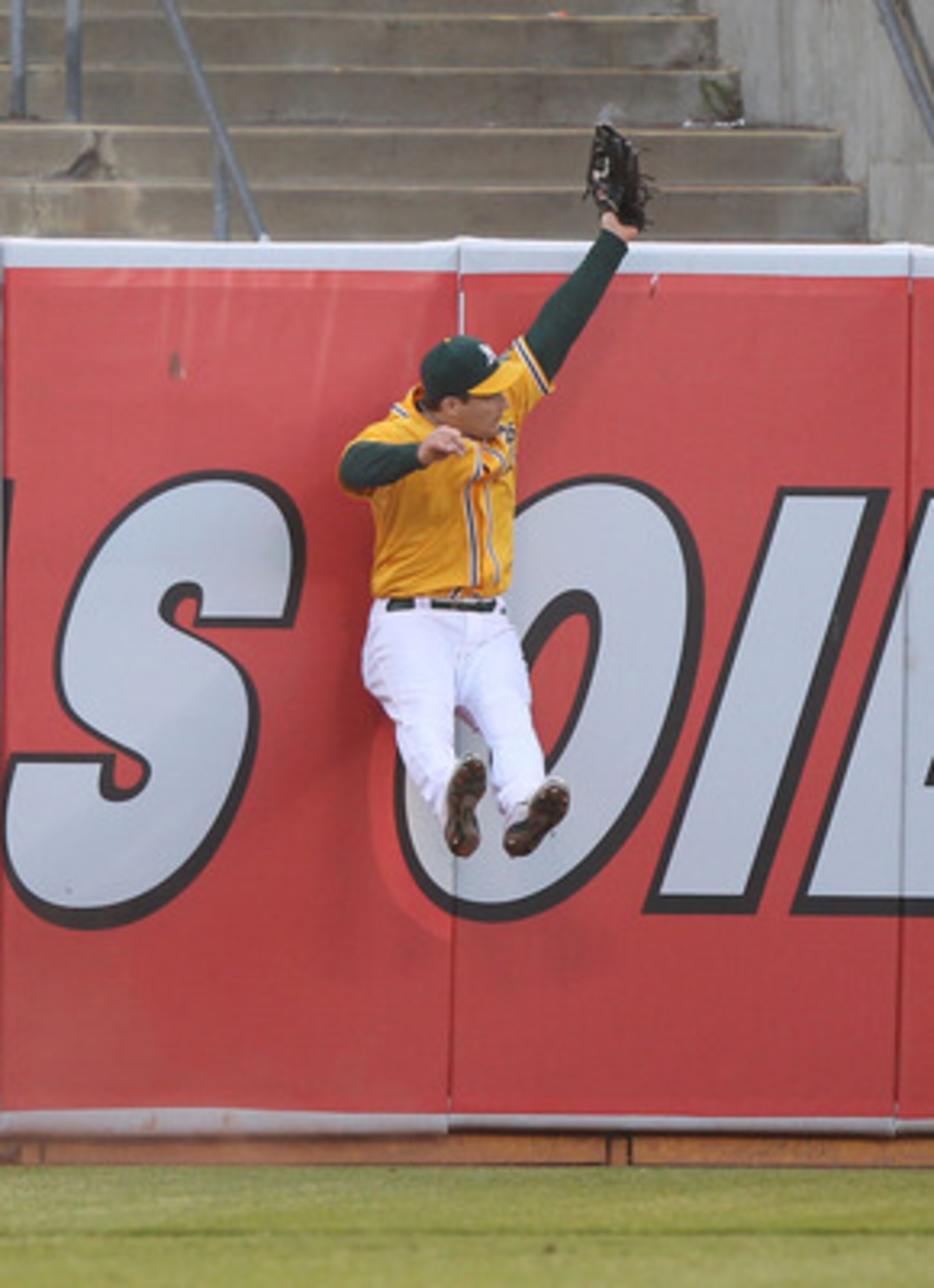 OAKLAND, CA - JUNE 15:  Josh Willingham #16 of the Oakland Athletics catches a ball hit by Matt Treanor #15 of the Kansas City Royals at the Oakland-Alameda County Coliseum on June 15, 2011 in Oakland, California.  (Photo by Jed Jacobsohn/Getty Images)