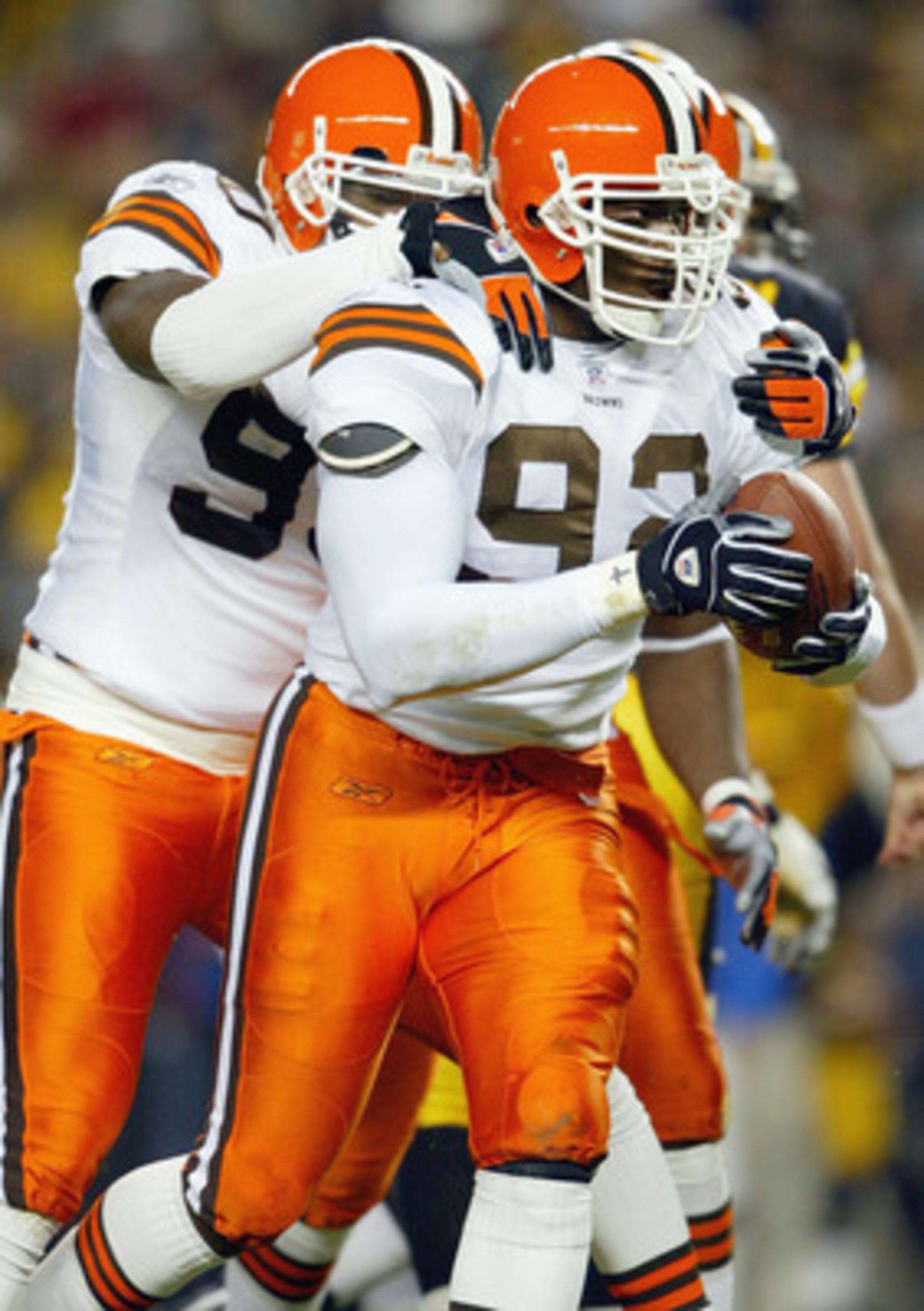 PITTSBUTGH , PA - OCTOBER 5: Courtney Brown #92 and Mark Word #90 of the Cleveland Browns celebrate a fumble recovery by Brown against the Pittsburgh Steelers on October 5, 2003 at Heinz Field in Pittsburgh, Pennsylvania. The Browns defeated the Steelers PITTSBUTGH , PA - OCTOBER 5: Courtney Brown #92 and Mark Word #90 of the Cleveland Browns celebrate a fumble recovery by Brown against the Pittsburgh Steelers on October 5, 2003 at Heinz Field in Pittsburgh, Pennsylvania. The Browns defeated the Steelers