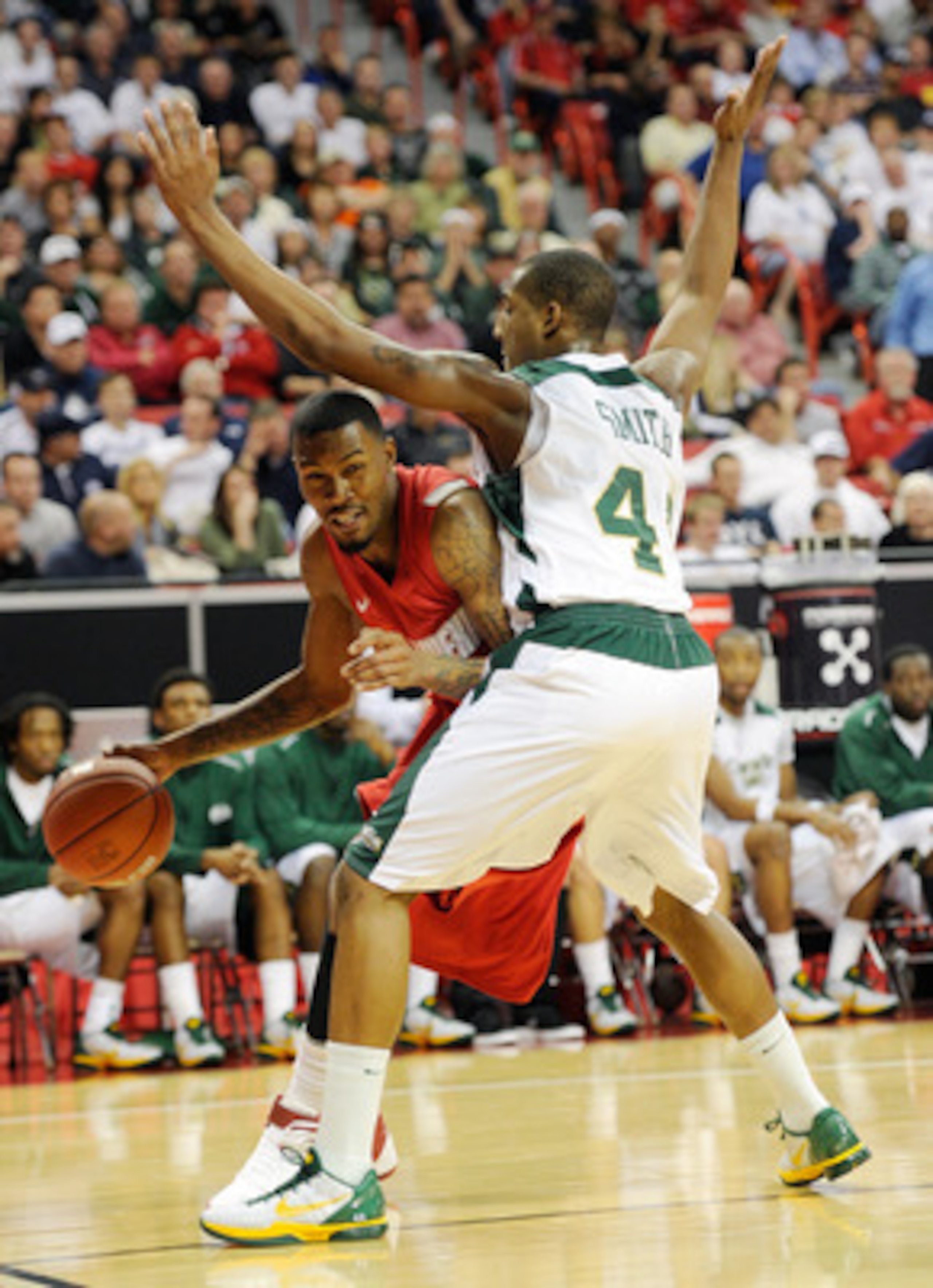 LAS VEGAS, NV - MARCH 10:  A.J. Hardeman #00 of the New Mexico Lobos drives against Greg Smith #44 of the Colorado State Rams during a quarterfinal game of the Conoco Mountain West Conference Basketball tournament at the Thomas & Mack Center March 10, 201