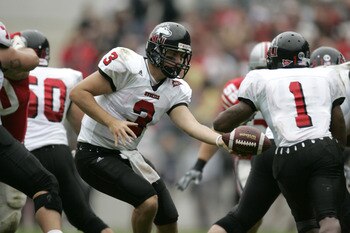 COLUMBUS, OH - SEPTEMBER 2:  Quaterback Phil Horvath #3 of the Northern Illinois University Huskies hands-off the ball to his running back Garrett Wolfe #1 during the game against the Ohio State University Buckeyes on September 2, 2006 at Ohio Stadium in