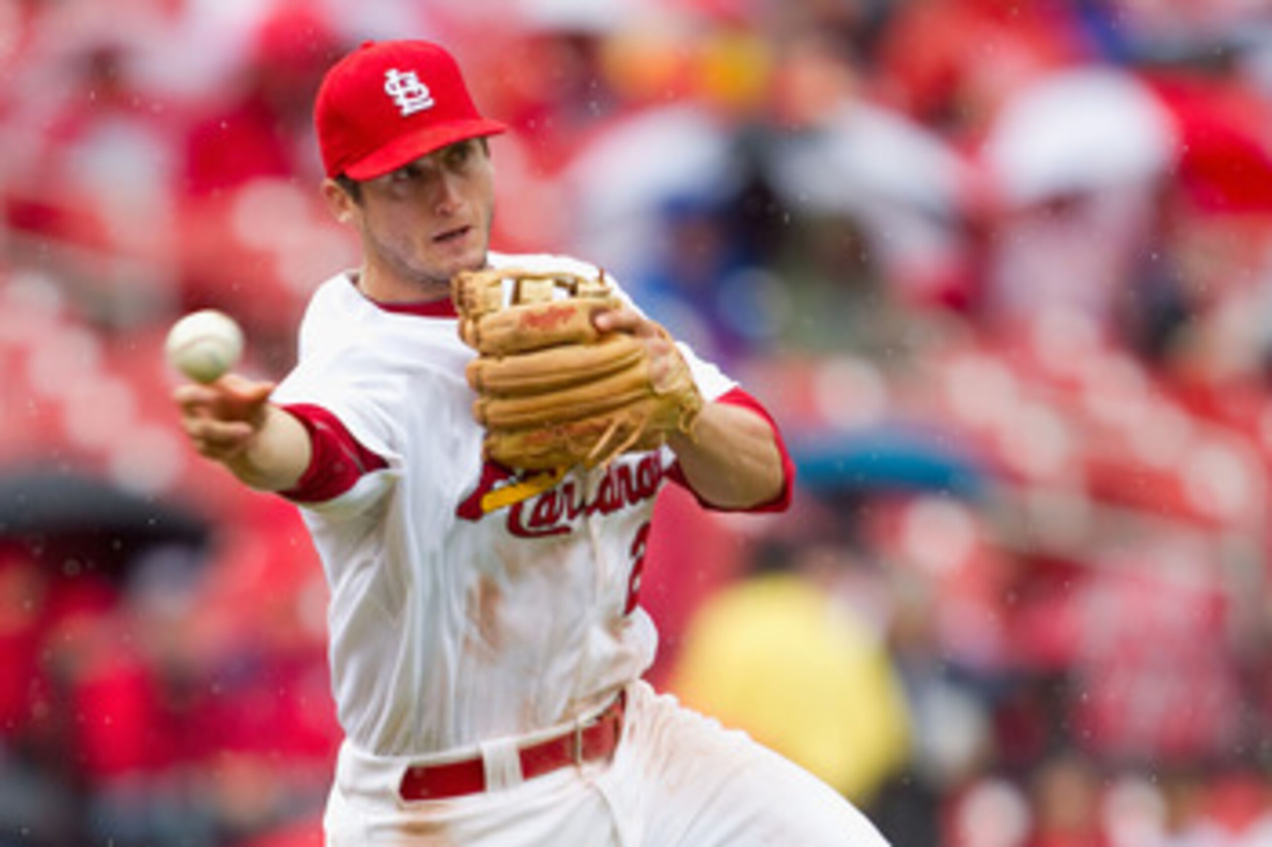 ST. LOUIS, MO - APRIL 23: David Freese #23 of the St. Louis Cardinals throws to first base against the Cincinnati Reds at Busch Stadium on April 23, 2011 in St. Louis, Missouri.  (Photo by Dilip Vishwanat/Getty Images)