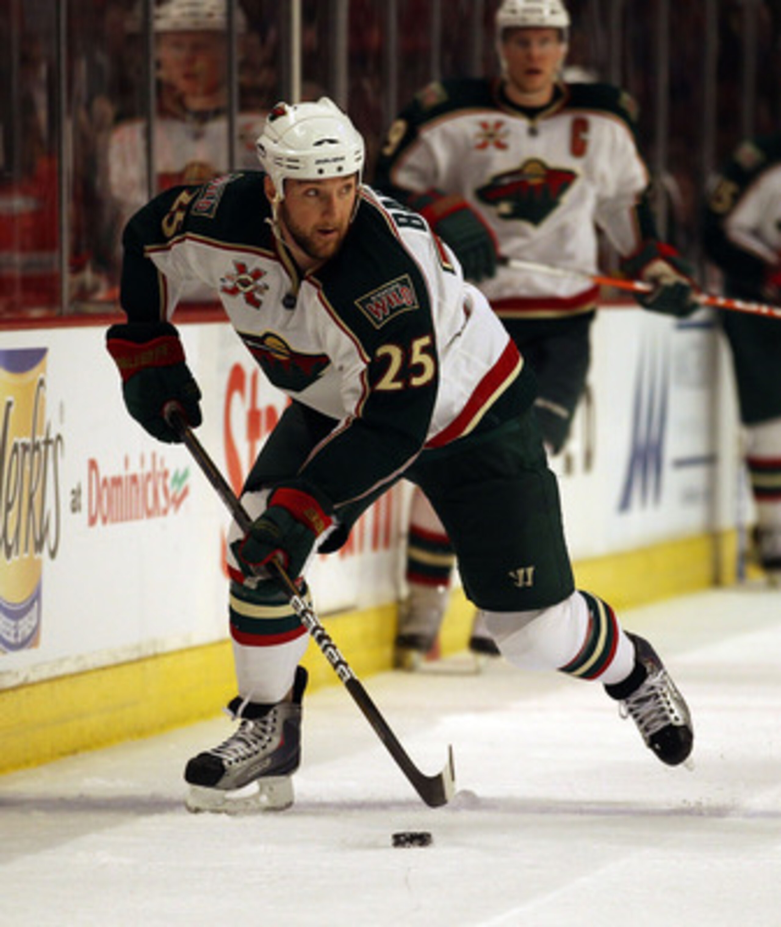 CHICAGO, IL - FEBRUARY 16: Cam Barker #25 of the Minnesota Wild looks to pass against the Chicago Blackhawks at the United Center on February 16, 2011 in Chicago, Illinois. The Blackhawks defeated the Wild 3-1. (Photo by Jonathan Daniel/Getty Images)