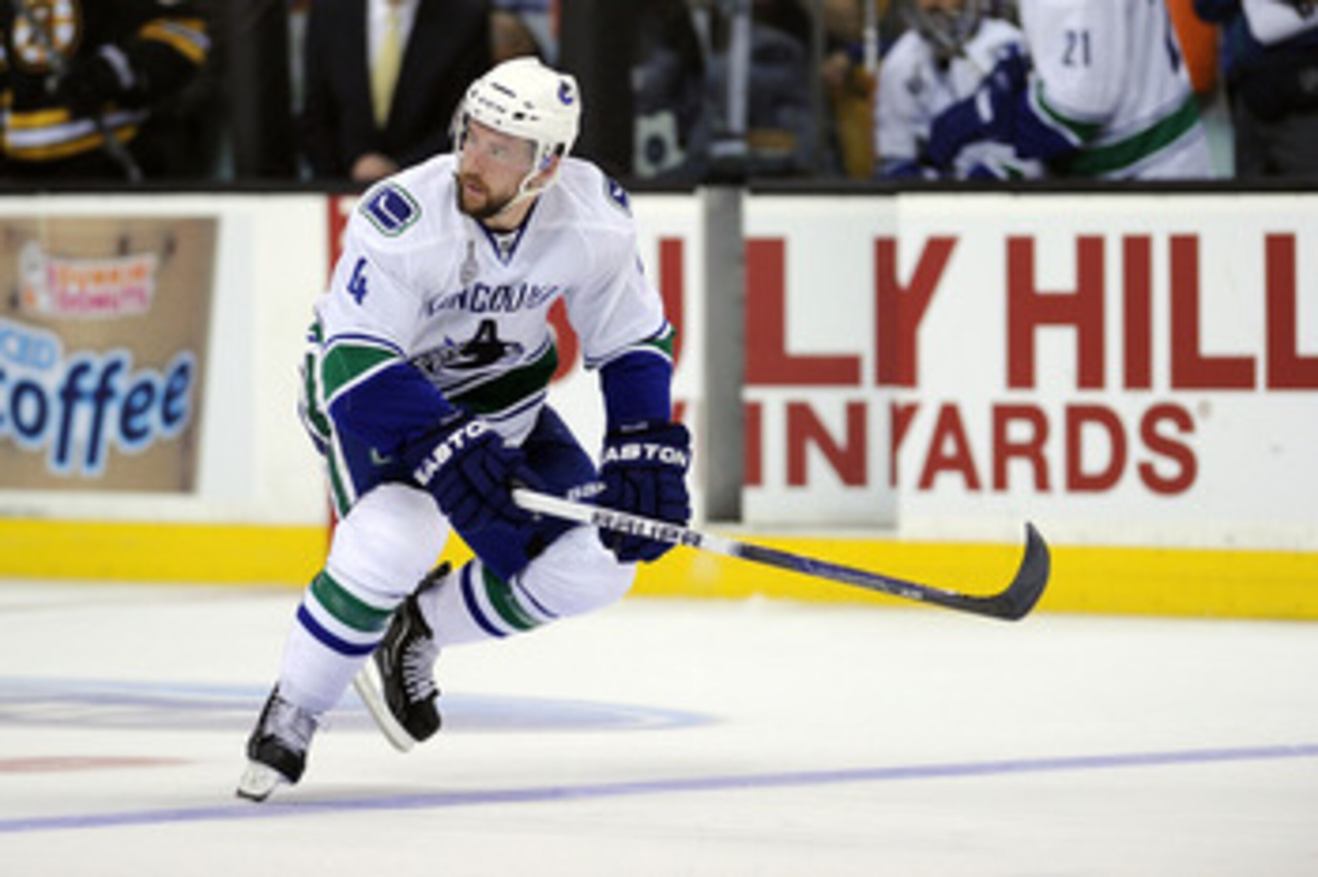 BOSTON, MA - JUNE 08:  Keith Ballard #4 of the Vancouver Canucks skates against the Boston Bruins during Game Four of the 2011 NHL Stanley Cup Final at TD Garden on June 8, 2011 in Boston, Massachusetts.  (Photo by Harry How/Getty Images)