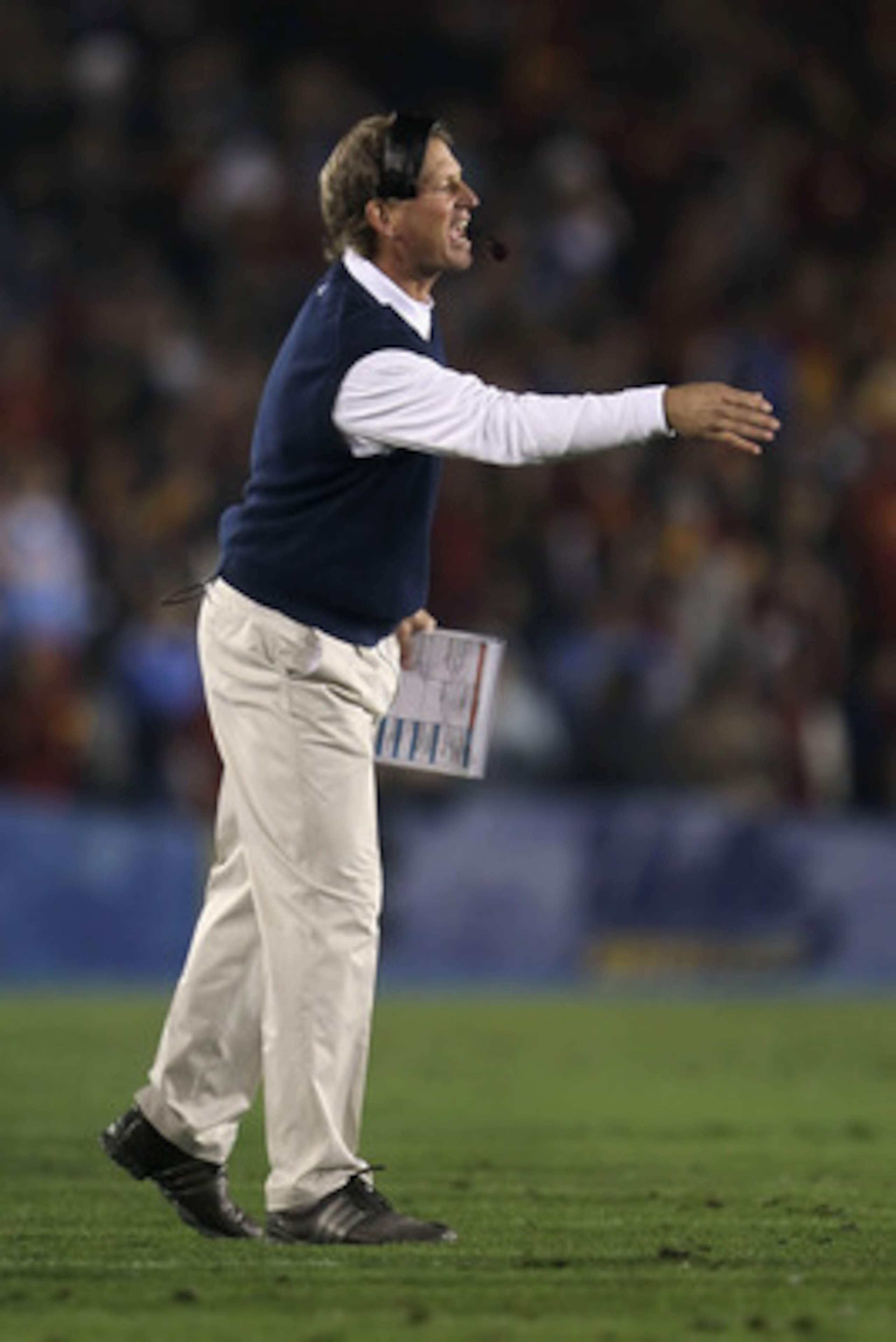 PASADENA, CA - DECEMBER 04:  UCLA Bruins head coach Rick Neuheisel yells from the sideline against the USC Trojans at the Rose Bowl on December 4, 2010 in Pasadena, California.  USC defeated UCLA 28-14. (Photo by Jeff Gross/Getty Images)