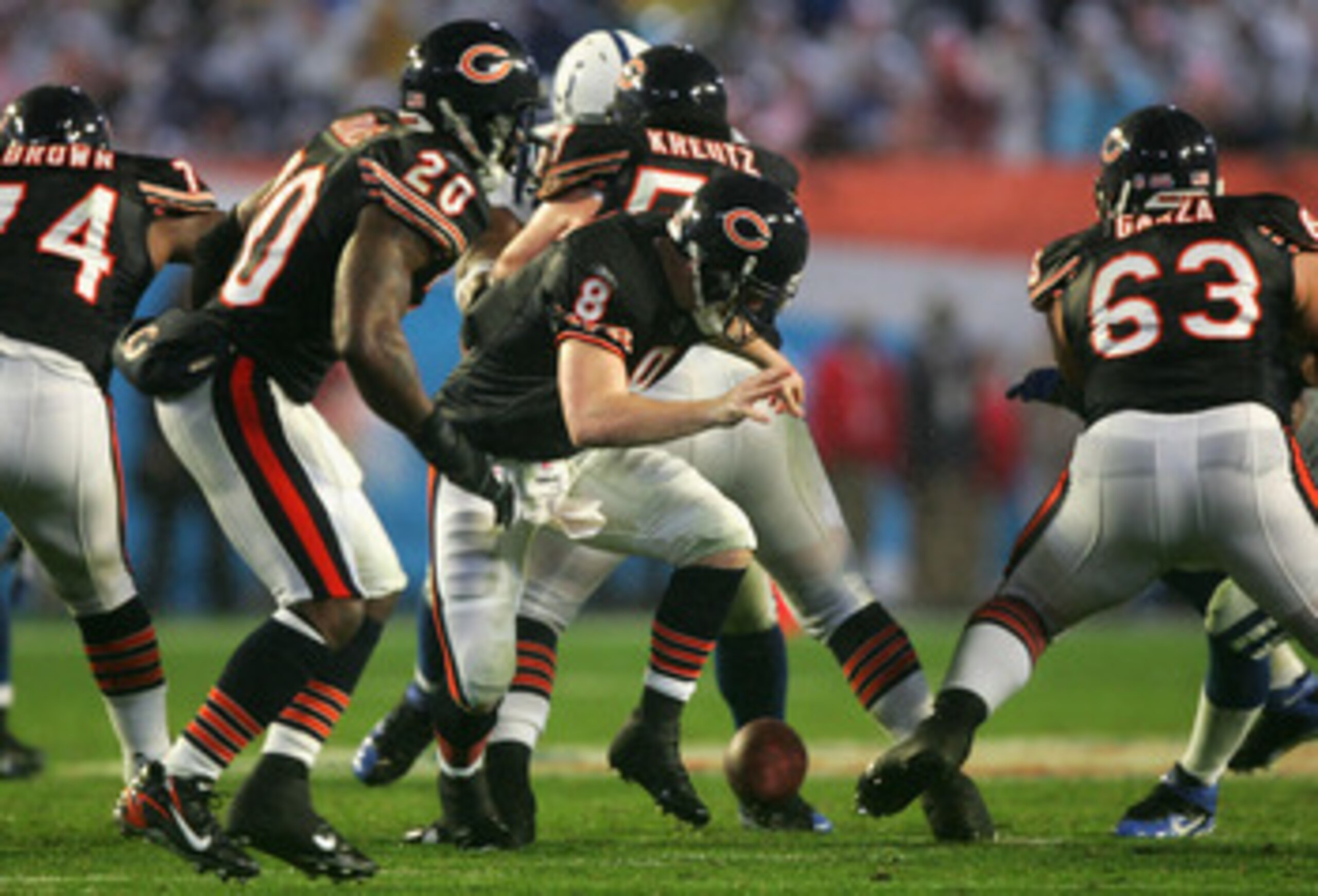 MIAMI GARDENS, FL - FEBRUARY 04:  Quarterback Rex Grossman #8 of the Chicago Bears fumbles a snap recoverd by the Indianapolis Colts during the second quarter of Super Bowl XLI on February 4, 2007 at Dolphin Stadium in Miami Gardens, Florida.  (Photo by J