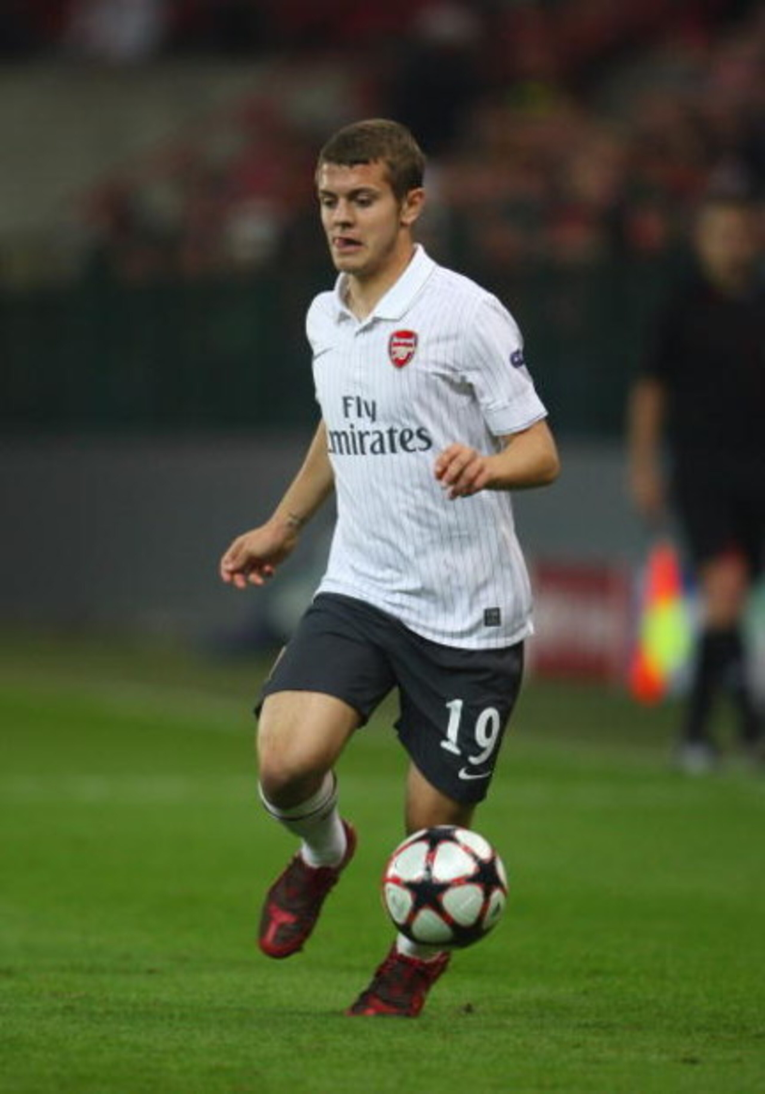 LIEGE, BELGIUM - SEPTEMBER 16:  Jack Wilshere of Arsenal runs with the ball during the UEFA Champions League Group H match between Standard Liege and Arsenal at the Sclessin Stadium on September 16, 2009 in Liege, Belgium.  (Photo by Jamie McDonald/Getty 