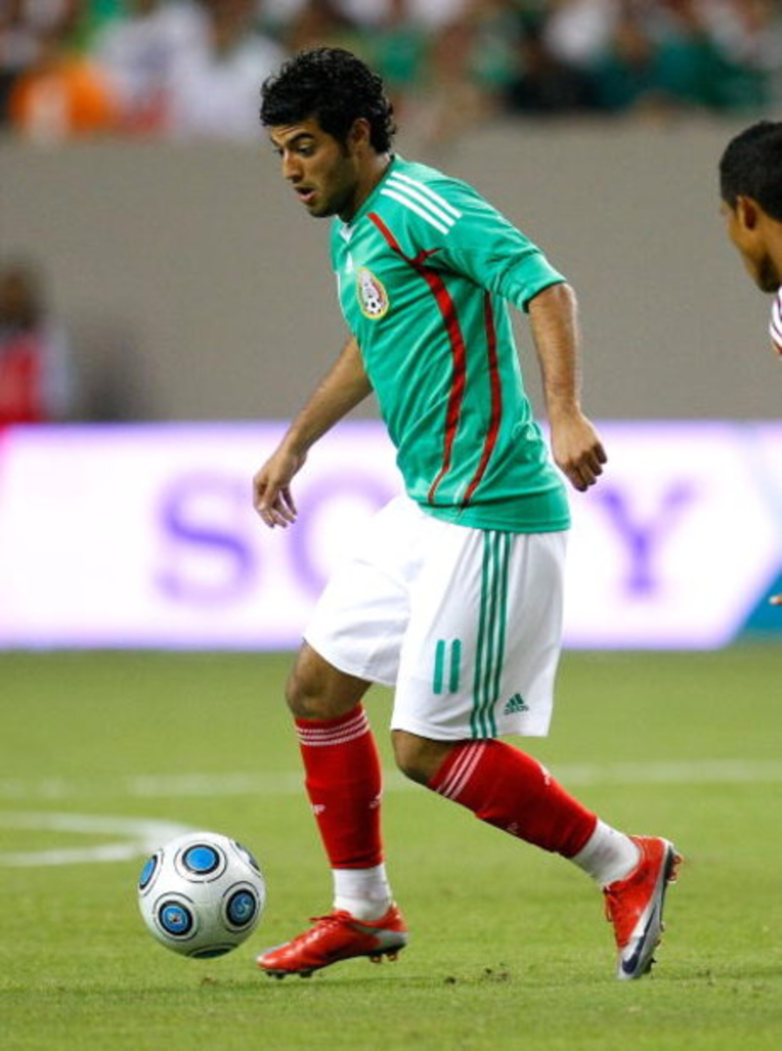 ATLANTA - JUNE 24:  Carlos Vela #11 of Mexico against Venezuela during their international friendly match at Georgia Dome on June 24, 2009 in Atlanta, Georgia.  (Photo by Kevin C. Cox/Getty Images)