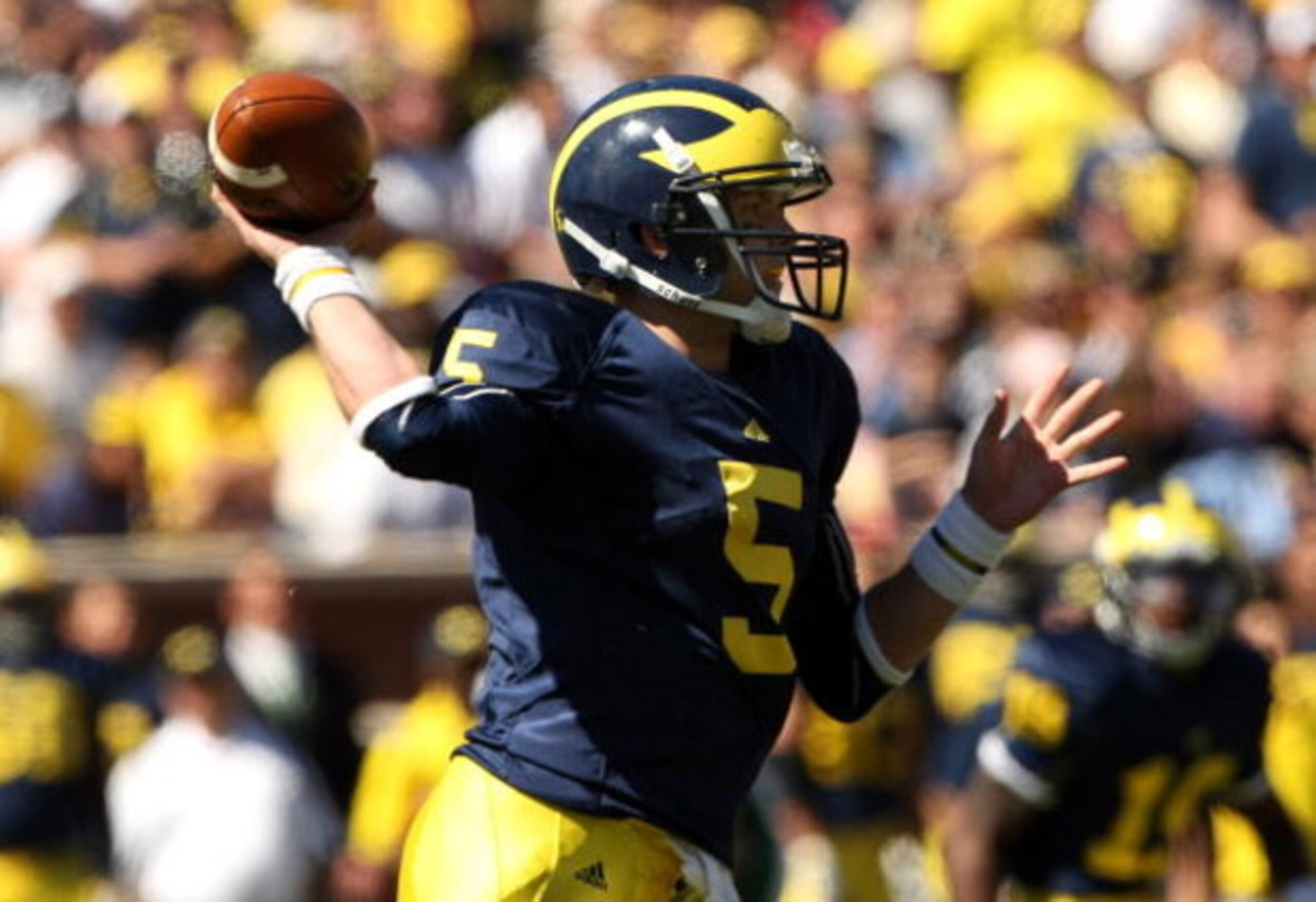 ANN ARBOR, MI - SEPTEMBER 19:  Quarterback Tate Forcier #5 of the Michigan Wolverines throws a pass against the Eastern Michigan Eagles at Michigan Stadium on September 19, 2009 in Ann Arbor, Michigan.   Michigan won 45-17.  (Photo by Stephen Dunn/Getty I