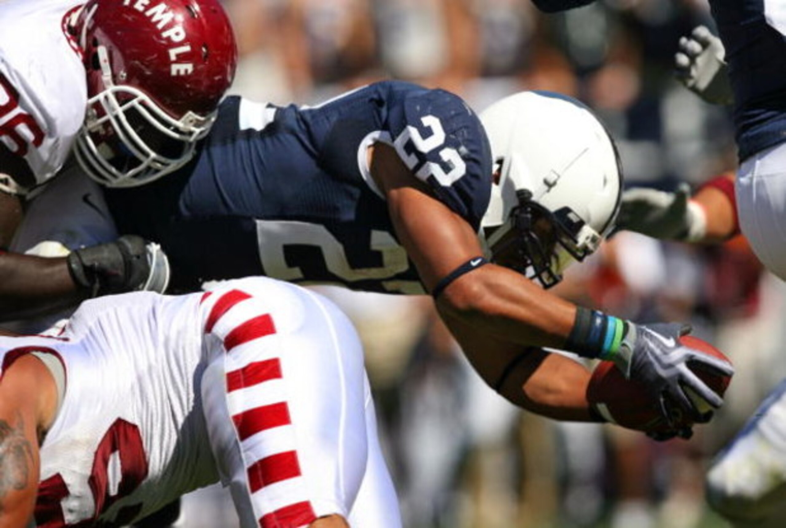 STATE COLLEGE, PA - SEPTEMBER 19: Running back Evan Royster #22 of the Penn State Nittany Lions dives into the end zone for a touchdown during a game against the Temple Owls on September 19, 2009 at Beaver Stadium in State College, Pennsylvania. (Photo by