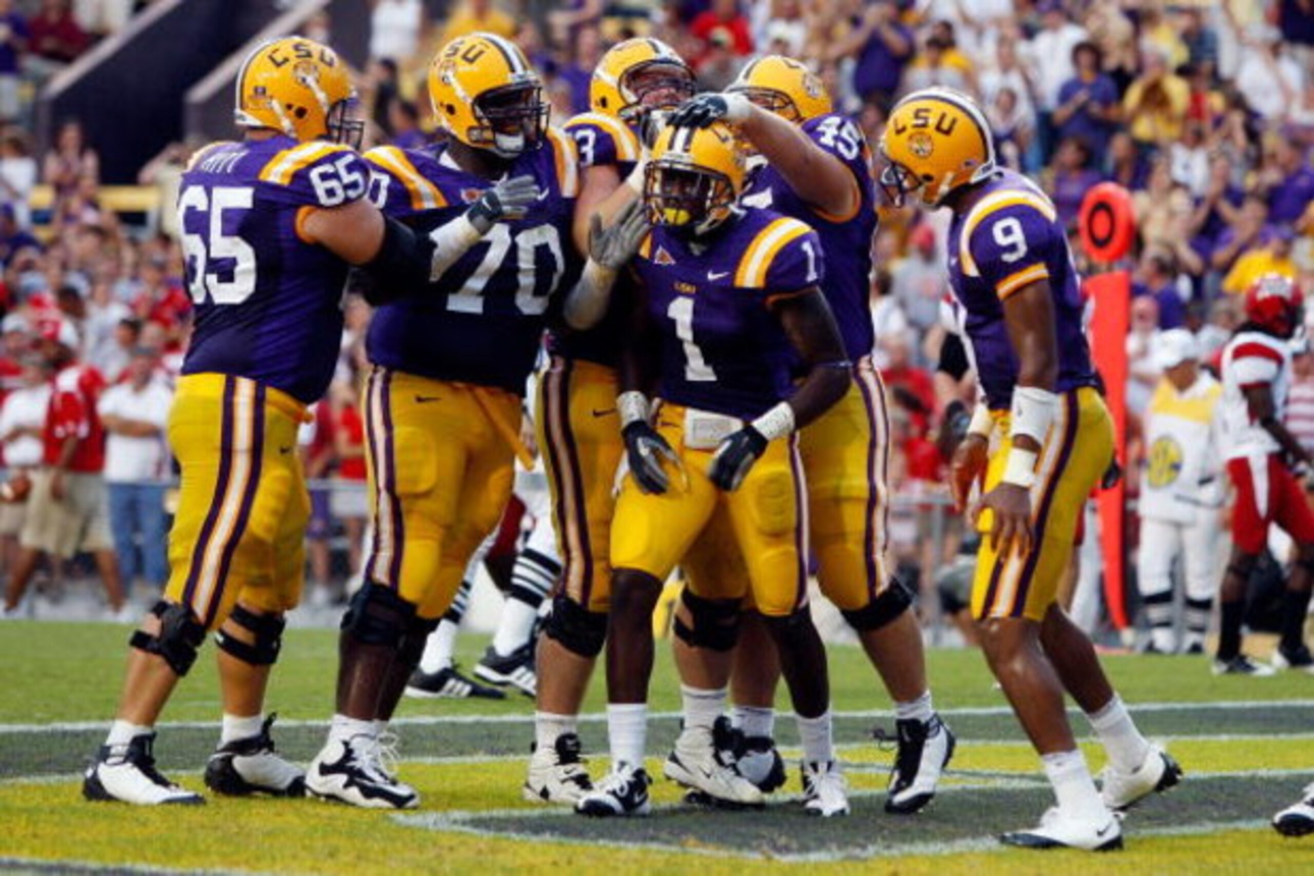 BATON ROUGE, LA - SEPTEMBER 19:  Brandon LaFell #1 of the Louisiana State University Tigers celebrates with teammates after scoring a touchdown against the University of Louisiana-Lafatette Ragin' Cajuns at Tiger Stadium on September 19, 2009 in Baton Rou