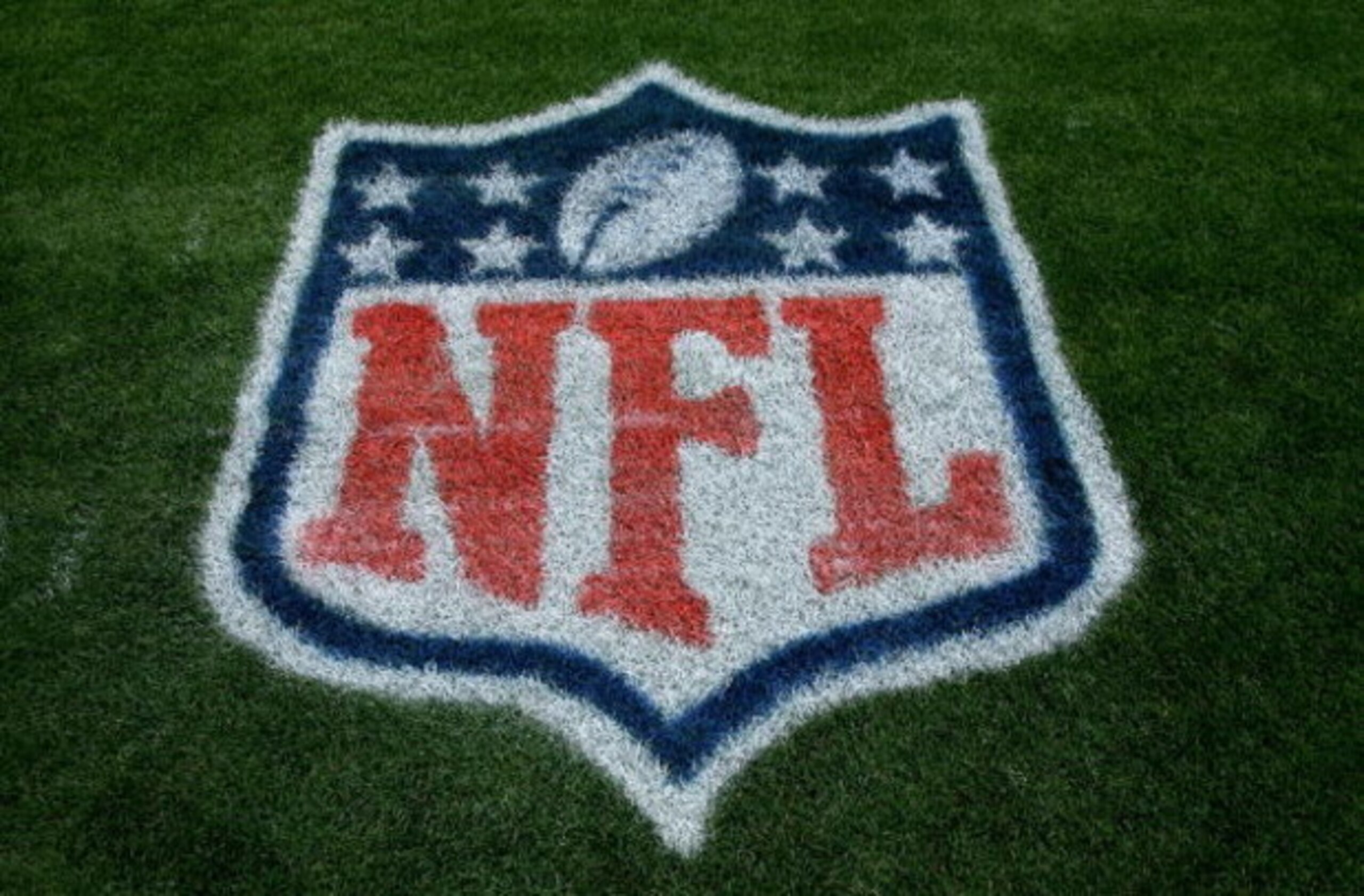 DENVER - SEPTEMBER 20:  A detail of the NFL logo on painted on the sideline grass as the Cleveland Browns face the Denver Broncos during NFL action at Invesco Field at Mile High on September 20, 2009 in Denver, Colorado. The Broncos defeated the Browns 27