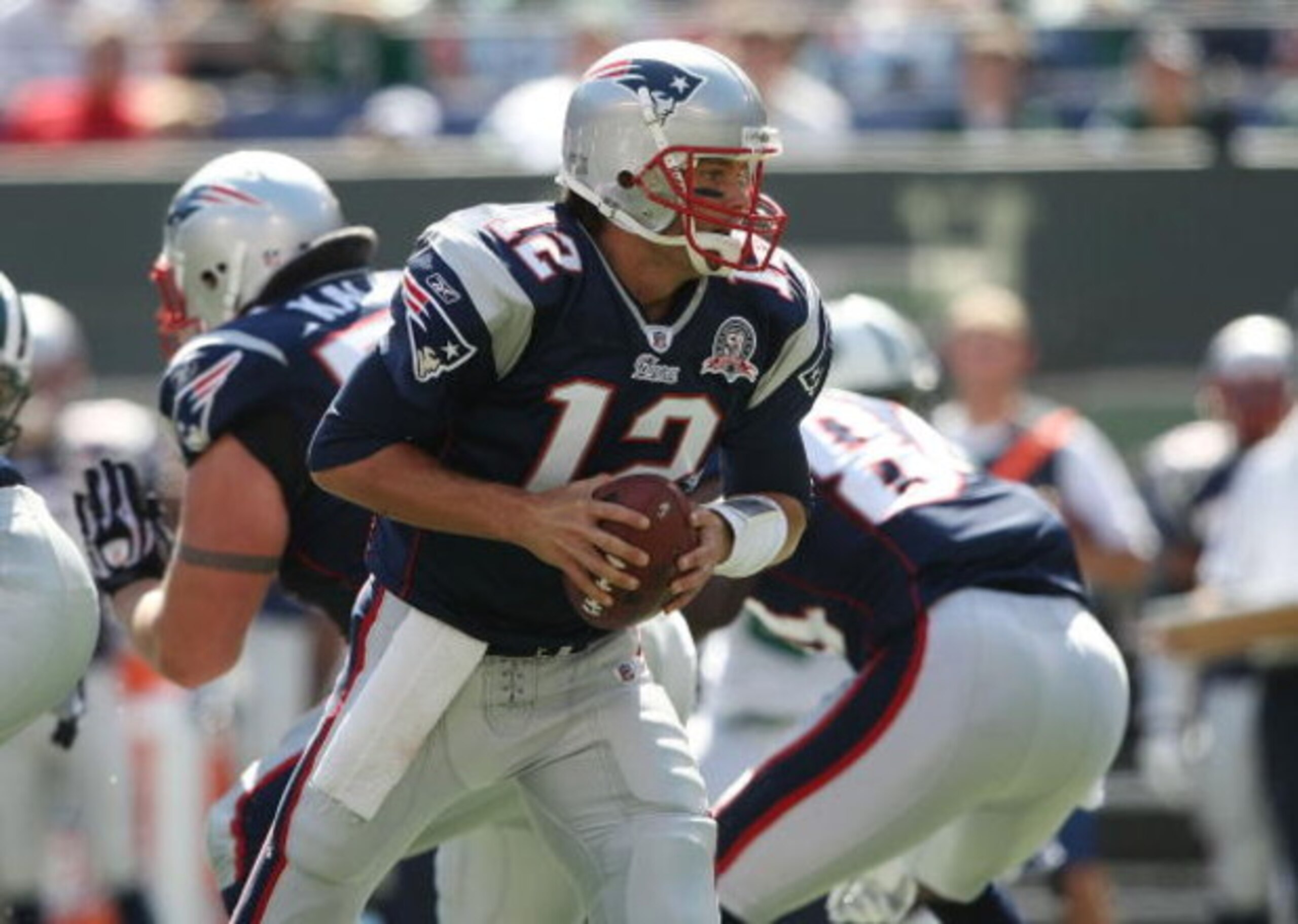 EAST RUTHERFORD, NJ - SEPTEMBER 20:  Tom Brady #12 of the New England Patriots runs with the ball against the New York Jets at Giants Stadium on September 20, 2009 in East Rutherford, New Jersey.  (Photo by Nick Laham/Getty Images)