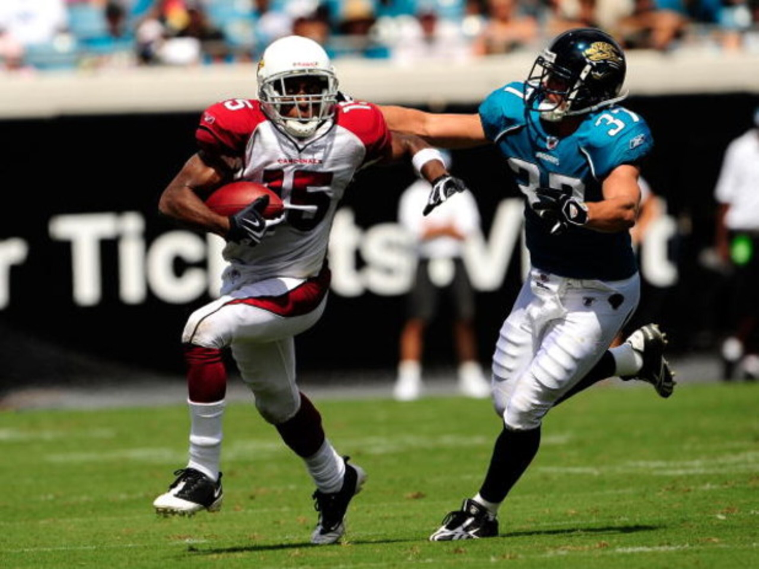 JACKSONVILLE, FL - SEPTEMBER 20:  Steve Breaston #15 of the Arizona Cardinals is chased by Sean Considine #37 of the Jacksonville Jaguars during the game at Jacksonville Municipal Stadium on September 20, 2009 in Jacksonville, Florida.  (Photo by Sam Gree