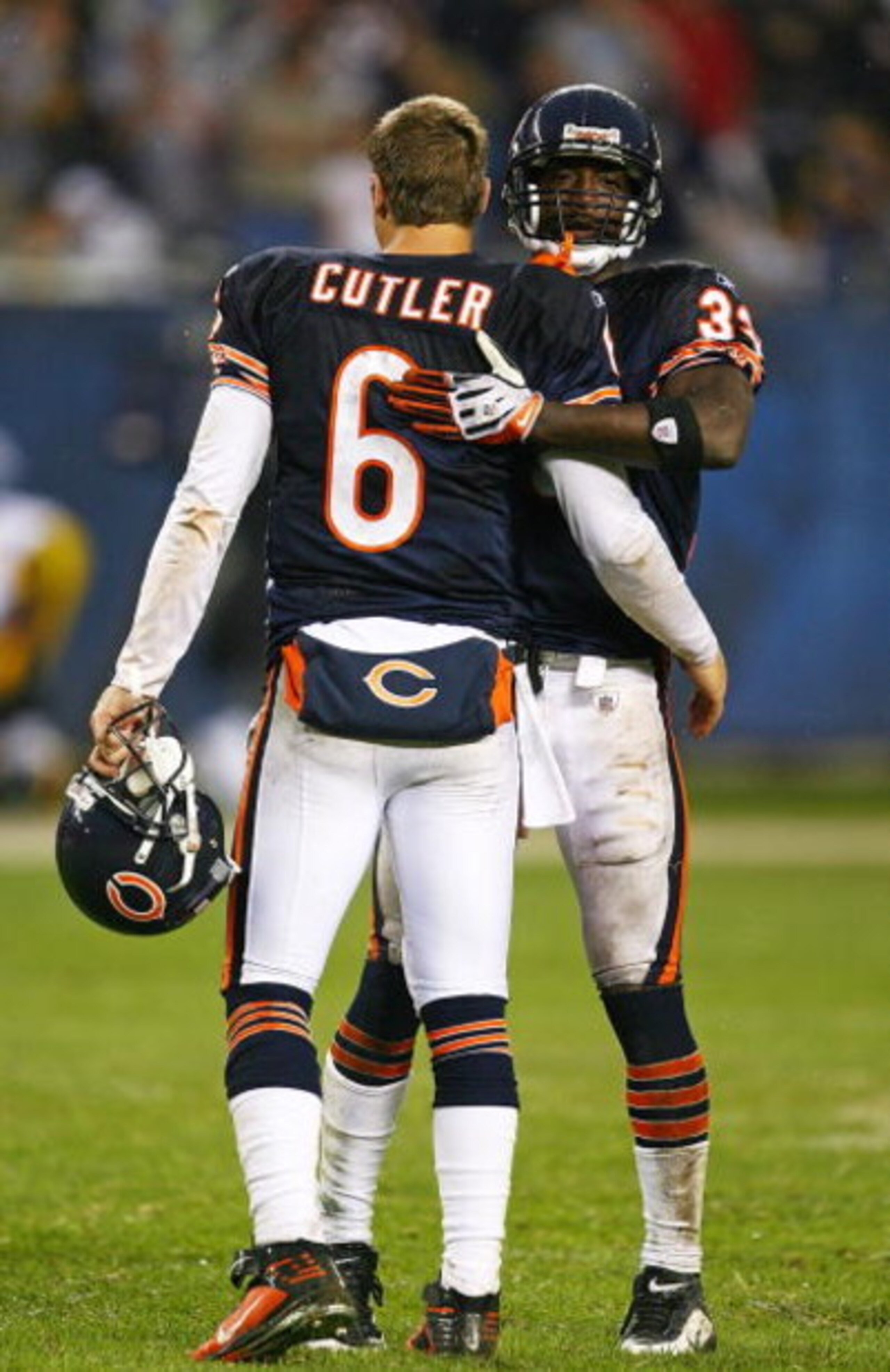 CHICAGO - SEPTEMBER 20: Charles Tillman #33 of the Chicago Bears hugs teammate Jay Cutler #6 after a win over the Pittsburgh Steelers on September 20, 2009 at Soldier Field in Chicago, Illinois. The Bears defeated the Steelers 17-14. (Photo by Jonathan Da