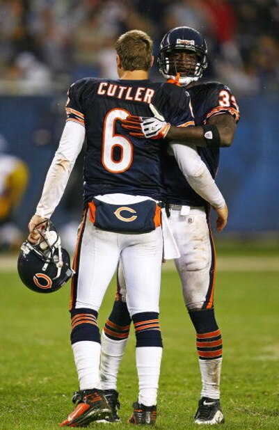 CHICAGO - SEPTEMBER 20: Charles Tillman #33 of the Chicago Bears hugs teammate Jay Cutler #6 after a win over the Pittsburgh Steelers on September 20, 2009 at Soldier Field in Chicago, Illinois. The Bears defeated the Steelers 17-14. (Photo by Jonathan Da